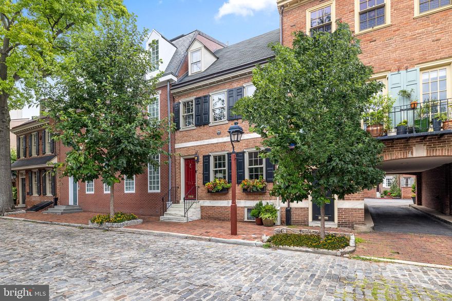 Original character and prideful upkeep are showcased throughout 213 Delancey St. This 3 bed, 2 full, and 2 half bath home is located in picturesque Society Hill, offering deeded parking, a modern kitchen, a finished basement, and a private patio. A tree-lined cobblestone street leads to the home's classic red brick facade featuring window shutters, lively planters, and a vibrant red door. Inside, beautiful hardwood floors stretch across the living room where distinctive details are on display. Crown molding frames the ceiling, chair rail trims the walls, shutters flank the windows, and a fireplace anchors the space. Past a center staircase and powder room, the sunlit gourmet kitchen is fitted with white custom cabinetry, stainless steel appliances, white stone countertops, and a peninsula with seating. There's also a dining area with wainscotting and built-ins. A pair of sliding doors open to the rear patio, perfect for grilling and al-fresco meals. The dedicated parking spot is just off the patio, making grocery unloading easy. More living space can be found in the home's lower level, where there's a finished basement ideal for a den, office, or gym, a powder room, and a utility room that holds the laundry. Up on the second level, a large bright bedroom sits at the front with details mirroring the living room, generous closet space, and a gleaming full bathroom. Another spacious bedroom with built-ins sits at the rear. The top level is dedicated to a third bedroom and a second full bathroom. In addition to everything inside, the 213 Delancey St's Society Hill location earns a Walk Score of 97! Neighboring Old City and lively South St are both a few blocks away, filled with entertainment, dining, and storefronts. Nearby, Penn's Landing hosts holiday events, and Spruce Street Harbor Park along the riverfront is a popular spot to hang out on good weather days. Plus, idyllic Washington Square Park, historic Independence Mall, Pennsylvania and Jefferson Hospitals, and Center City are all within walking distance. There's also easy access to shopping centers on Columbus Blvd, I-95, I-676, and South Jersey. Schedule your in-person or virtual tour today!
