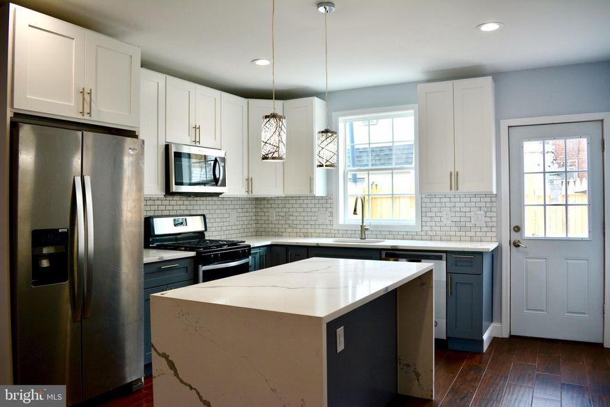 Tilton Street Never Looked so Good! Fresh renovation like new construction, 2 Large Bedroom 2 Full bath Townhome in quaint section of 19125, close to everything shopping/restaurants/bars/95 and of course the Development of The Delaware River Waterfront just 2 block away make this a prime location for settling down before the prices go up.  Enter your new home to an open concept first floor with amazing light streaming through from the front and back. The owner spared no expense in the selections and attention to detail of this sleek and modern townhome with full finished basement. Brand new everything SS appliances, granite and tile with waterfall island, dishwasher, garbage disposal and a generous assortment of cabinets economically and efficiently arranged for maximum functionality. The back yard is neat and clean with new concrete and fencing, you can arrange an inviting outdoor room/lounge/eating  area with barbecue, and if you are a plant lover, plenty of sunlight will enable you to enjoy a lovely potted garden. The fully finished downstairs could be a master bedroom/movie/living  room or office with tiled floors, full bath/ laundry and large egress window.  Upstairs you have 2 large bedrooms with ample amounts of closet space along with a huge bathroom with double vanities and tiled stall shower. Come take a look and imagine the possibilities when you move in and make this wonderful neighborhood your home with easy access to all major roadways and public transportation and within walking distance to popular restaurants such as famous Tacconelis Pizza, Memphis Taproom, Philadelphia Brewing Co., Tired Hands, Hinge Cafe, and Stock's Bakery, plus Fishtown Crossings (to name a few). Aramingo Square is also walking distance including Cione Playground and close proximity to Penn Treaty! Do not miss your chance to own this truly special home in lively Fishtown!