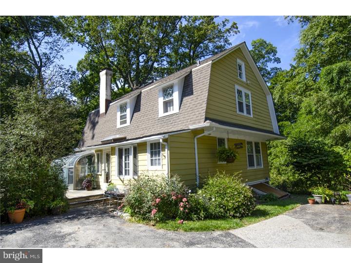Welcome to this charming and secluded colonial farmhouse that was once the gardener's cottage for adjacent property.   Tucked away down a long drive, it has the feel of country living, is quiet and peaceful, yet located close to everything.  Built in 1928, it retains many original architectural features such as 9' ceilings, lattice windows, wainscoting, and hdwd floors, yet is updated with modern amenities.  New kitchen, A/C, FR addition, gracious LR w/fp and coffered ceiling, partially finished basement with playroom and full bath, 3 spacious bedrooms and full bath on 2nd floor; 3rd flr loft office finished with skylights and carpet, and floored attic for storage.  Mature gardens and evergreens surround the flagstone patio and level yard, and the back yard landscaping features vintage pillars and stone steps leading to Iven Avenue.  The greenhouse is original to the gardener's cottage and all systems are still functioning, and two gardening sheds are nestled in the shrubbery.  A vintage home with character and charm, and a tranquil retreat at the end of the day!