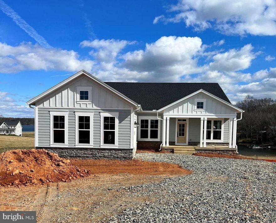 WATERFRONT HOME! LONG VIEWS! Welcome to Rock Island! Lake Anna's Newest Waterfront subdivision located on the private side of Lake Anna. This Windward Model offers amazing lake views from your composite back deck and approximately 100ft of shoreline.  

NOW INCLUDES BRAND NEW DOUBLE DECKER BOATHOUSE- EST COMPLETETION 60 DAYS
 
This home features a deluxe kitchen equipped with stainless steel appliances, beautiful white cabinets and upgraded quartz countertops throughout the spacious kitchen. Gorgeous waterproof luxury vinyl plank floors cover most of the home. Come relax in the large open family room with 12 ft ceilings and large windows overlooking the water as you perch above Lake Anna. On the main level you will find the owners suite with glass doors opening up to the rear screened in deck. This floor plan also features 2 additional bedrooms with private bathrooms, and a formal study all on the main level. The rear of the home overlooks the stunning views of the lake. The finished lower level offers an enormous Recreation Room, 4th Bedroom, full bathroom, and an unfinished media room/fitness room.  

**This home is 90% finished, completion date projected in March 2024 just in time for the Summer season. Some photos are from a similar build at a different location. 

10 YEAR WARRANTY INCLUDED.

OFF SITE OPEN HOUSE LOCATED AT 254 ROCK ISLAND RIDGE MINERAL, VA 23117.
EVERY SAT/SUN 12-3PM.