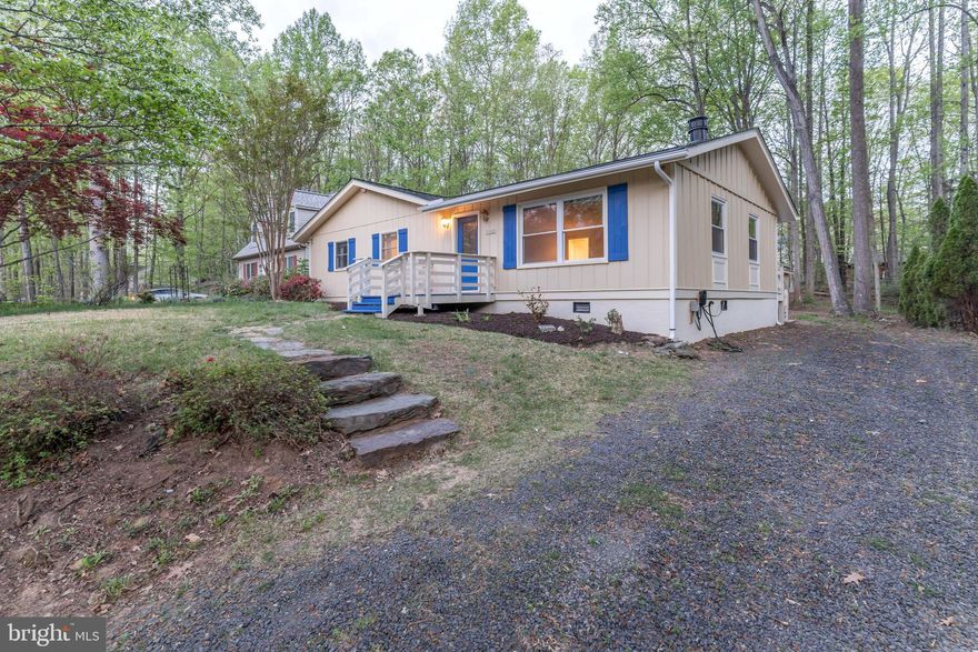 Welcome to 102 Monument Road! If you love spacious living, you will love this home! The entry welcomes you into the expansive living room which boasts built-in book shelves, cabinets and a unique stand alone wood burning fire place, an impressive space! Beautiful French doors lead you into a den with another cozy brick, wood burning fireplace. Enjoy preparing meals in the galley style kitchen with gleaming granite countertops, and stainless steel appliances. All NEW Flooring !!! With four bedrooms, you will have plenty of accommodating space. Step outside into the sweeping deck with a large table and chairs, a platform pergola to surely impress your guests as you provide so many spots for entertainment and relaxation. There's even a workshop/man cave/she-space to escape to with a/c and heat. You could also enjoy a short walk to Cornwallis beach. A private, gated, secured community, Lake of the Woods offers anything and everything you could possibly want. Home to two lakes (the 550 acre main lake and a 35 acre "fishing lake"), a golf course, an equestrian center, a fire and rescue department, and a church all within the gates, Lake of the Woods simply has it all. Whether your passion is boating, water skiing, kayaking, golfing, horseback riding, or simply taking in the breathtaking views from the clubhouse while enjoying a fabulous meal, from your own deck or yard, or from one of the beaches, you won't be disappointed! Perhaps you'd like a game of bridge or volunteering your time and talents...Lake of the Woods offers more than 60 clubs and/or organizations from which you may choose to become involved. Lake of the Woods is the perfect community for both full-time residents, as well as weekenders.