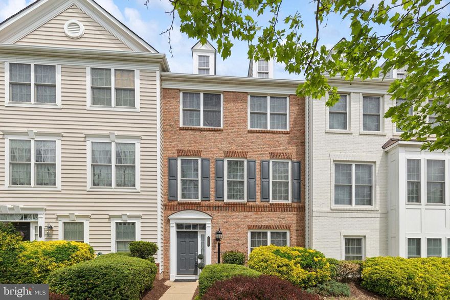 Beautiful Former Model Home in Gated Community.  Step inside to the 3 Finished Levels with Wood Flooring Throughout.  Lower Level features a 4th Bedroom/Office with Full Bath.  Main Level Has Welcoming Living Room with Fireplace, adjacent to the Dining Room.  Gourmet eat-in Kitchen with Granite Counters and Backsplash, Stainless Steel Appliances.  Spend Summer Evenings relaxing on the Deck off the Kitchen.  Upper Level has Spacious Primary Bedroom with Spa Like Bath, and 2 Additional Bedrooms, and Full Bath.  Home is Situated in the Quiet Area of the Community.  Amenities Galore include Indoor and Outdoor Pools, State of the Art Fitness Center,  Sauna, Rock Climbing Wall, Playgrounds, and Business Center.  Walk to Stonebridge Town Center.  Less than 1 Mile to I-95, Commuter Lots, Bus, Restaurants, and Shopping Galore.  Seller may need a short rentback.