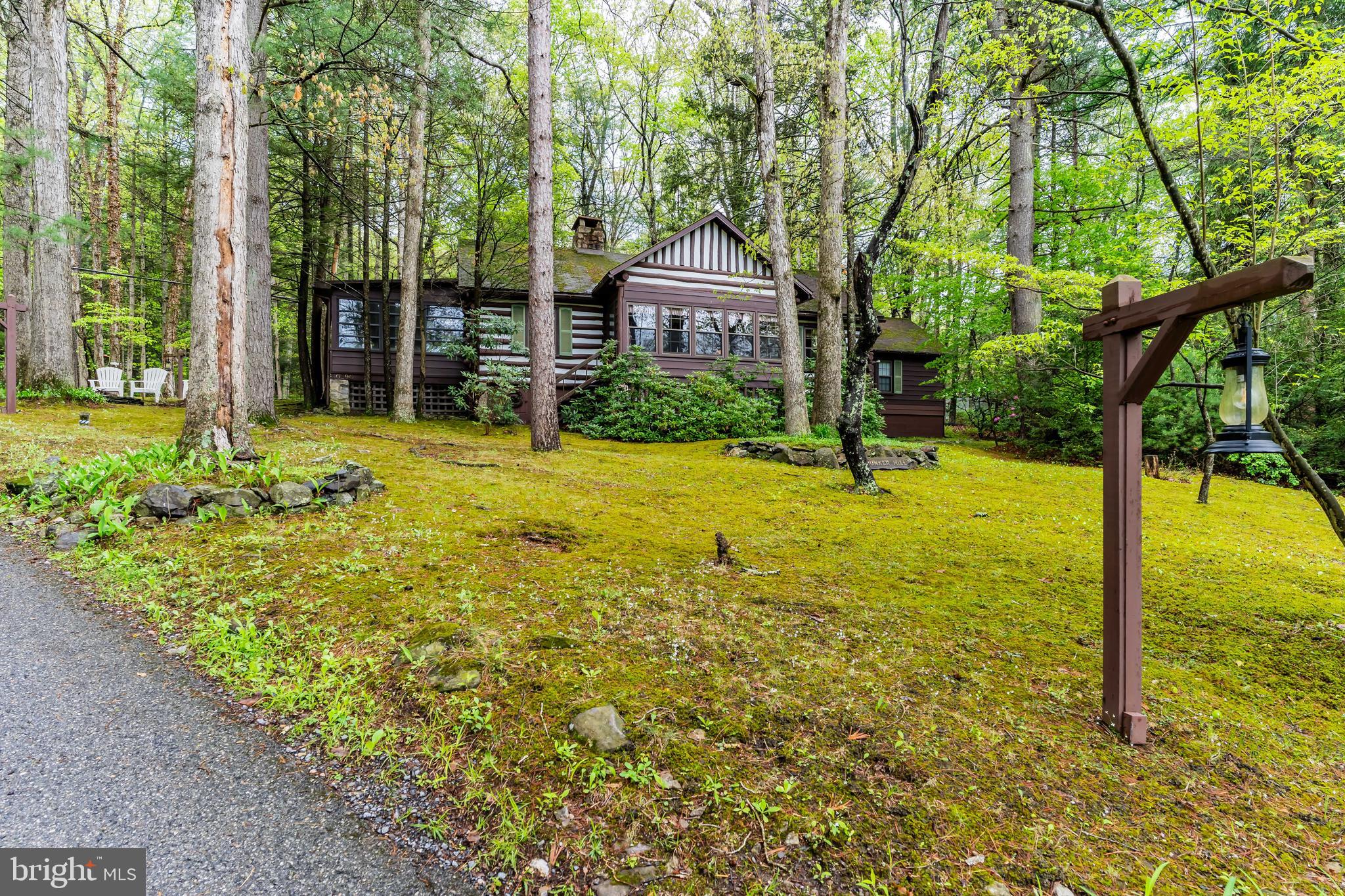 Welcome to 10290 Golf Course Road and "Bunker Hill"
Nestled in the serene setting of Michaux State Forest, this exquisite log home, built in 1930, exudes timeless charm and rustic elegance. With its unique construction and inviting ambiance, this property offers a rare opportunity to embrace a lifestyle of comfort of a cozy retreat that lies within.
The open-concept living area with large wooden hearth showcases the stunning craftsmanship of the log construction. High ceilings and expansive windows create an airy atmosphere or step out to tranquil views of the surrounding landscape from the 2 porches.
Whether you seek a peaceful retreat or a vibrant community, this property provides the perfect balance. With its rich history and unique architectural features, this home is awaiting your personal touch and to create lasting memories.
Seller is offering a $7,500 Seller Allowance for the non-working Air Conditioning Unit.
There are certain Power equipment in the Garage that can be purchased from the Seller that do not convey