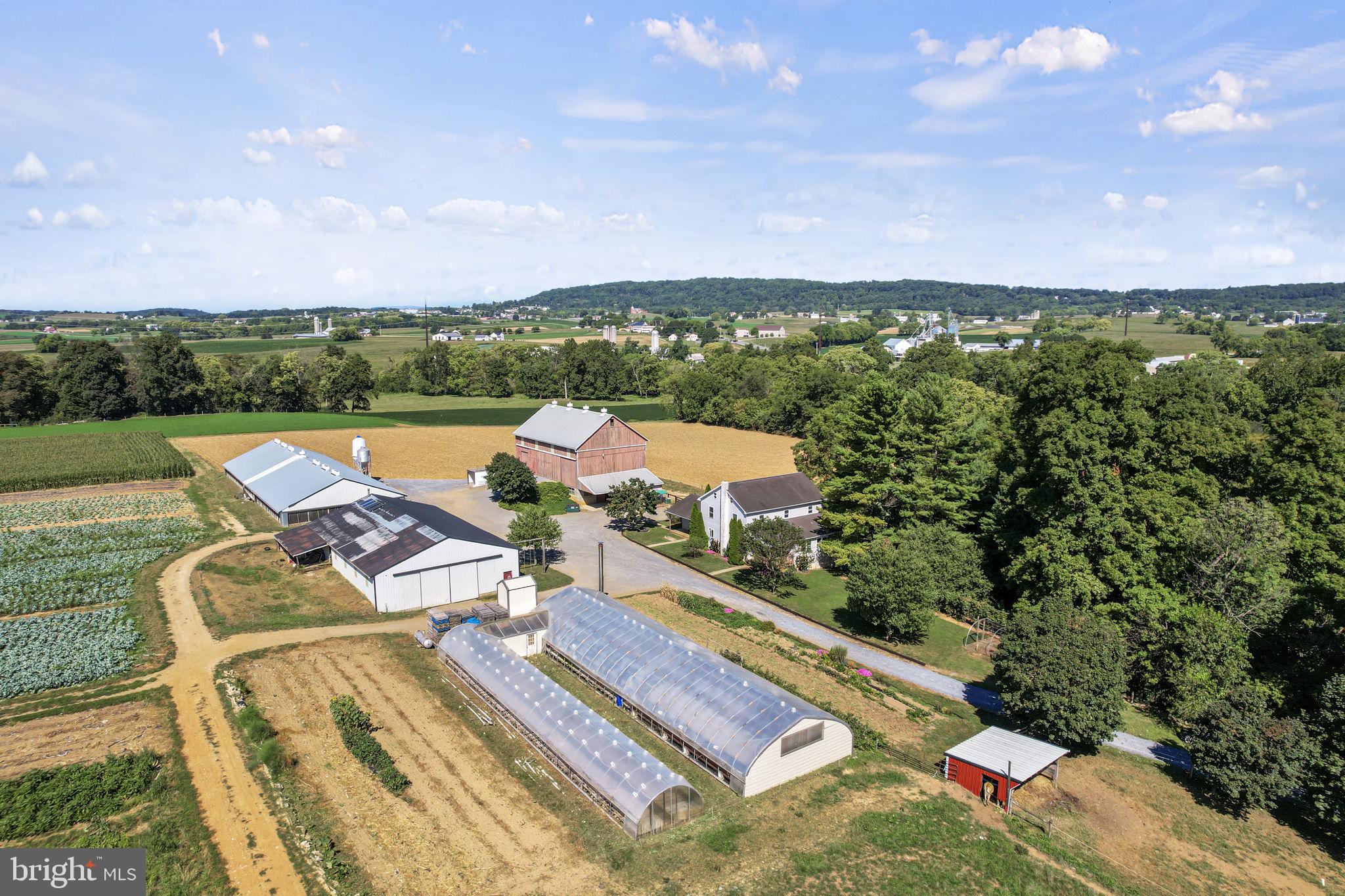 Charming 33-Acre Produce Farm in Ephrata, PA
Discover the potential of this stunning 33-acre farm, ideally situated in the heart of Ephrata. Perfect for produce farming, the gently sloping fields provide ample space for cultivation. The property features a spacious 5-bedroom, 1-bathroom home with 3,000 square feet of comfortable living space.
Property Highlights:
Bank Barn: 40x64 feet with an overhang, ideal for storage or livestock.
Equipment Shed: 48x80 feet, including a 20x28 foot workshop for all your tools and machinery.
Duck Barn: A fully remodeled 50x136 foot barn, updated in 2022.
Greenhouses: Two greenhouses—one 30x96 feet and another 15x96 feet—to support your growing operations.
Yanmar Diesel Generator: Reliable power source to meet your farming needs.
Storage Tanks: Five 500-gallon air tanks and one 1,000-gallon propane tank for all your storage requirements.
Solar System: A 1,000-watt solar system for energy efficiency.
Irrigation System: A 3-inch underground irrigation system, with water pumped from Conestoga Creek to ensure consistent watering.
This well-maintained farm is ready for your produce-growing ambitions, with all the necessary infrastructure already in place. Don’t miss this opportunity to own a productive farm in a prime location.
Open House:
September 20, 2:00 PM to 6:00 PM
October 4, 2:00 PM to 6:00 PM