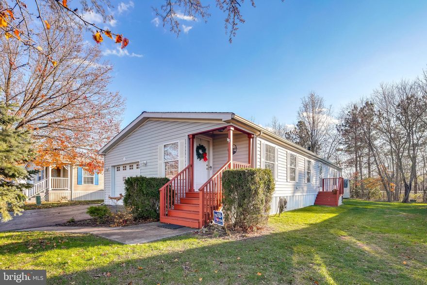 Wow! Location, location, location. This amazing manufactured home is located on a large corner lot on a cul-de-sac street. You will enjoy the many features this home has to offer including the attached garage, the large Screened in deck 2 years old, 4 year old heating & air, roof years old, pellet stove 4 years old, tankless water heater 3 years old, Kohler walk in tub 3 years old,  laminate flooring 5 years old & excellent floor plan. Who says you can't have it all? Call today for more information or to schedule your private showing.