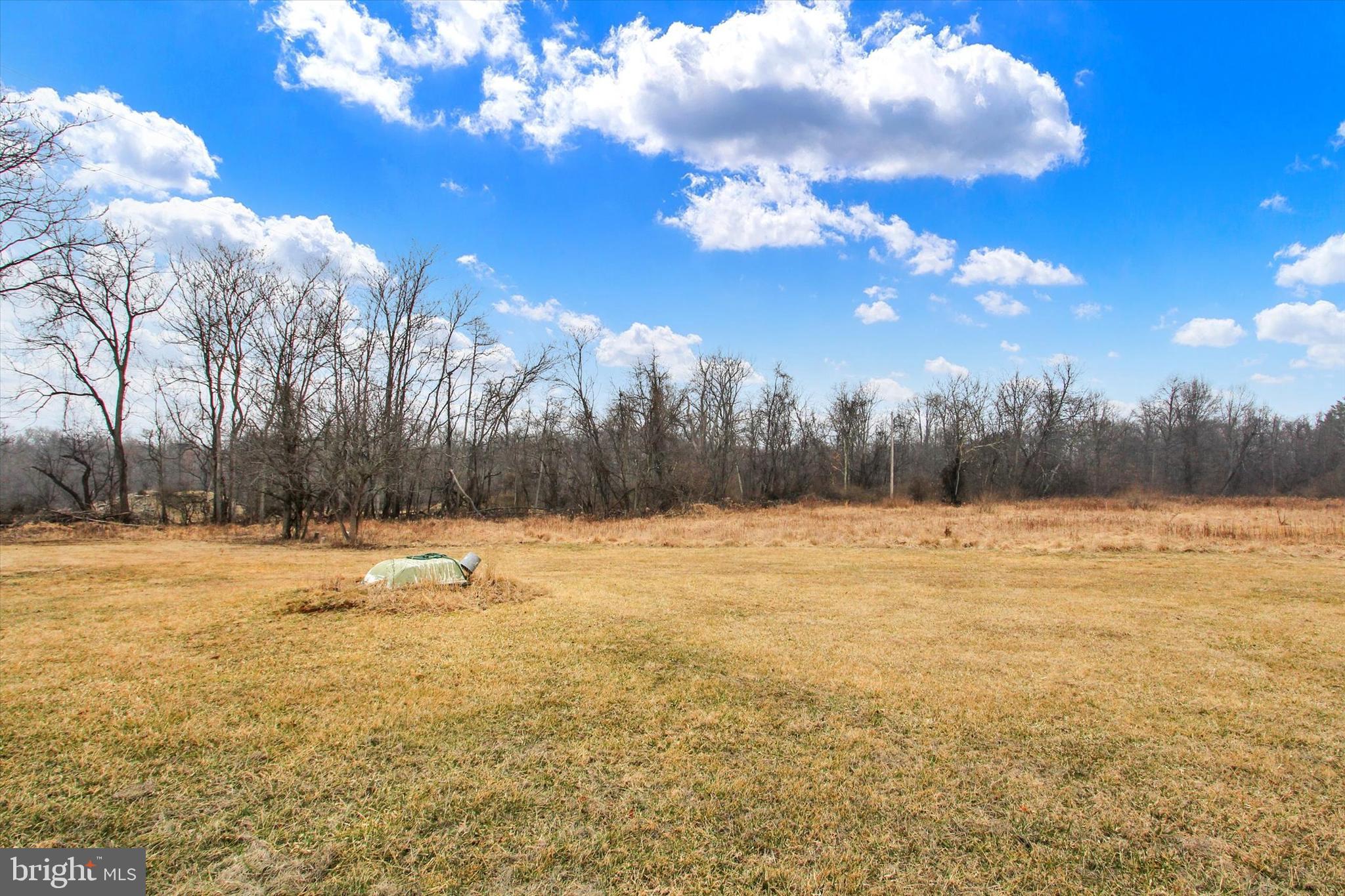 This level, partially wooded 2.33 acre lot comes complete with an already installed sandmound system, enhancing its readiness for construction. This property is zoned Village zoning which allows for various uses. Enjoy the private rural setting while being close to amenities, including ski and golf resorts, Historic Gettysburg, shopping, and dining options. The shared lane and abundant wildlife add to the charm, making it an ideal location to build your dream home. Experience the best of both worlds with serene surroundings and easy access to various attractions and conveniences.