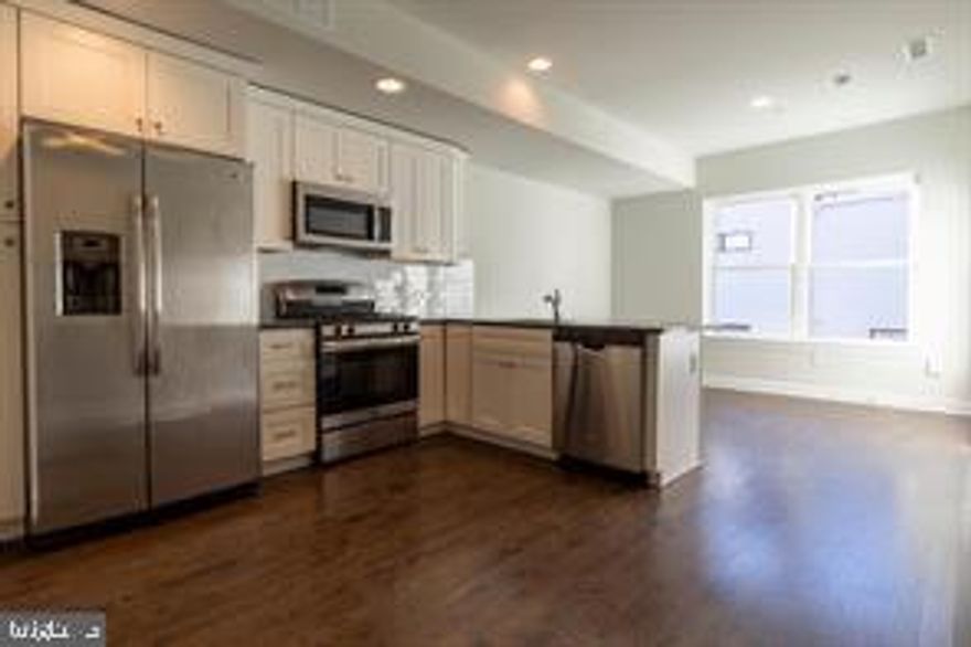 Welcome Home to your beautiful  2 bedroom/ 2.5 bathroom bi level unit.   Enter into the kitchen and dining area with sleek and modern finishes throughout boasting white shaker  cabinets and stainless appliances, breakfast bar, wood flooring throughout, central air and heat, ample natural light, and in-unit washer/dryer for added convenience. Your first full bathroom and bedroom are on this floor. The second floor has a spacious living area, half bathroom and your primary bedroom with a private bathroom and access to your roof deck with Center City and Ben Franklin Bridge views. Schedule your showing today! About The Neighborhood: Located conveniently at the intersection of Girard and Front street, you'll enjoy the convenience of plentiful public transportation options, as well as an abundance of local attractions and entertainment options. A block away from Frankford Ave's notorious bars and cafes, you'll love living in Philadelphia's "coolest" neighborhood! (Frankford Hall, The Fillmore, Johnny Brenda's, Garage, and more!). Lease Terms: Generally, first month, last month, and one month security deposit due at, or prior to, lease signing. Other terms may be required by Landlord. $45 application fee per applicant. Pets are conditional on owner's approval and may require an additional fee, if accepted. (Generally $500/dog and $250/cat, or monthly pet rent). Tenants responsible for all utilities: $60 flat monthly water fee, gas, electricity, cable/internet.