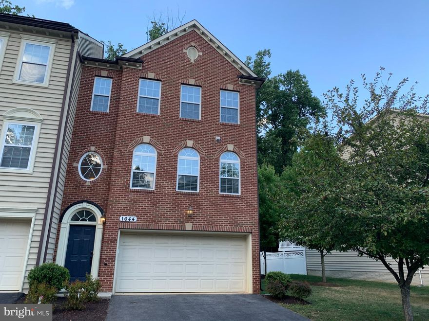 Luxury End Unit townhouse with a contemporary open floor plan and an attached two-car garage located in the White Oak subdivision of Silver Spring for rent. This spacious 3 bedroom 3 1/2 bathroom gem sports a huge updated eat-in kitchen boasting granite countertops and island, high-end cabinetry, stainless steel appliances, recessed lighting, and large pantry. Other features include hardwood floors on the main level, large Master suite with vaulted ceilings, walk-in closet, full bathroom en-suite with separate soaking tub, shower, and a double sink, separate dining area, finished basement, abundant natural light throughout, deck, and much more. Close to 29, 495, 95, 200. Close to the new Adventist hospital, Target, Trader Joes, and lots of other shopping. Walkable to public transportation. Lot backs to state-protected land with wooded view. Tot lot and visitor parking spaces directly in front of the home.
