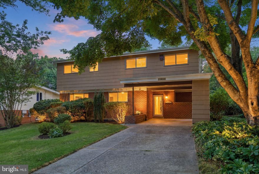 Warm and inviting, unique mid-century modern split-level nestled in the heart of desirable Kemp Mill Estates. This spacious 4-bedroom, 2 full and 2 half-bath home offers the perfect blend of timeless character, comfortable living spaces, and a beautiful natural setting.

Surrounded by manicured landscaping, the home welcomes you with a large private yard, new wood fence, patio for outdoor entertaining, and multiple storage options including a large detached shed and attached exterior storage area in carport. Ample off-street parking is provided by the driveway and carport.

Inside, the welcoming foyer features generous closet space and opens to newly installed slate flooring in the kitchen and dining areas. The bright kitchen is appointed with golden oak cabinetry, Corian countertops, and plenty of room for everyday cooking and gathering. The spacious dining room is ideal for hosting holidays and special occasions.

Just a few steps up, the stunning living room becomes the heart of the home with cathedral-style ceilings, abundant natural light, and sliding glass doors that open to the patio and lush backyard. A bedroom and convenient half bath on this level provide flexible space for guests, a home office, or multigenerational living.  Beautiful hardwood flooring flows through the top two levels of the home.  

Upstairs, you’ll find three generously sized bedrooms with excellent closet space, an updated hall bath with tub, and a private en-suite bath with shower in the primary bedroom.

The walk-out lower level features a cozy wood-paneled recreation room with fireplace and half bath — the perfect spot for movie nights, game days, or relaxing by the fire. A large utility, laundry, and storage room includes a new 200-amp electrical heavy-up.

Nature lovers will appreciate being just one block from access to the scenic Northwest Branch Trail, moments from Kemp Mill Estates Park and Wheaton Regional Park. Conveniently located near shopping, restaurants, grocery stores, Wheaton Metro, and countless everyday amenities, this special home offers both tranquility and accessibility in one of Silver Spring’s most beloved neighborhoods.