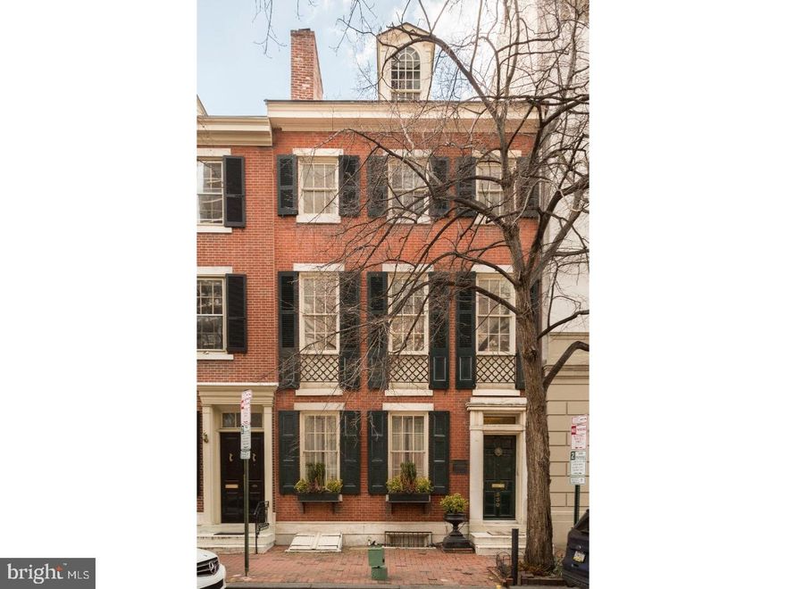 Immense historic restoration of the Thomas Sully residence in Society Hill featuring 5 beds, 5.5 baths, library, yoga room, office, 5 outdoor spaces, in-law apartment, 3-car garage, 6 zoned HVAC and more. National historic landmark built in 1796 by George Coombe in the Greek revival style. It begins with a marble vestibule into a grand hallway. Behold the grand formal dining rm highlighted by its ornate original mantle + black crystal chandelier. Original archway leads to the formal living rm, complete with the comfort of a gas fireplace + the convenience of a double French door that opens right onto a private inner courtyard. The kitchen is a chef's paradise offering custom cabinetry, 2 Miele DWs, double Jenn-Air SS oven, Liebherr fridge with wine cooler freezer, custom copper Vent-A-Hood, Wolf 4 gas burner/2 induction stove, copper farmhouse sink, copper prep sink, insta-hot water + filter tap, subway tile backsplash, quartzite countertop  + beautiful bar counter overlooking the charming breakfast area.  The 2nd flr offers an impressive library with soaring vaulted ceilings, 2 skylights, handsome built-ins + large deck that connects to the inner courtyard. Front master suite offers 3 windows, grand ceiling, detailed molding, fireplace mantle + chandelier. The en-suite bath is to die for, with heated faux-wood tile floors, Carrera marble half wall wainscoting, mantle, designer washstands, oversized sconces, clawfoot tub, watershed, marble stall shower with glass enclosure, Rohl fixtures + walk-in closet. The 3rd flr hosts 2 spacious bedrms connected by a jack-and-jill bath, complete with wood wainscoting, WaterWorks tile tub, dual vanity with quartzite countertop, wall sconces + ToTo toilet. 4th flr is an open studio with a very elegant full bath with handmade Tabarka Studio tile floor, Walker Zanger tile wall, stall shower with frameless glass door + Kohler fixtures. French doors lead out to an arched rooftop terrace with immense southern exposure + big sky views. The lower level offers a terracotta tile floor, cedar closet, pantry closet, fridge, storage, wine storage, laundry rm, access to the street, an office, a full spa bath with sauna + a yoga/workout room. Newly built 3-car garage with climate control, 2 electric car chargers + stairwell up to the in-law apartment offering 1 bedroom, 1 bath + pilot house out to an incredible AstroTurf rooftop terrace on a pedestal system with Teak Pergola + outdoor cabinetry with quartzite countertop + sink.
