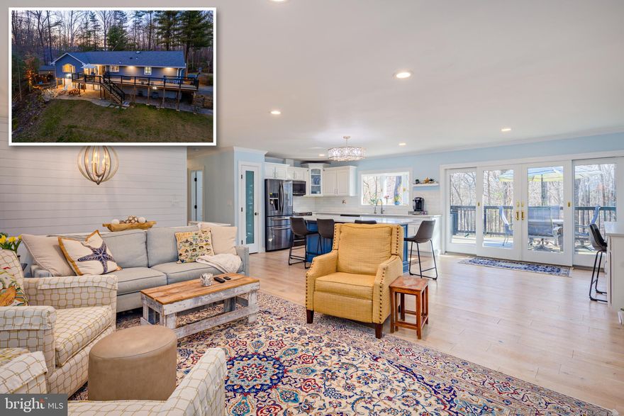 Welcome home to your stunning, completely renovated split level retreat, where every detail has been meticulously crafted to perfection! Nestled on a charming corner lot spanning just over an acre, this exquisite residence redefines the notion of modern luxury living.

As you step through the front door, you're immediately greeted by the warmth of the inviting foyer, now transformed into a true entryway that sets the stage for the elegance that awaits within. No longer just a passageway, this foyer serves as a grand welcome to all who enter.

This remarkable renovation includes a spacious addition, adding a new primary suite that will surely become your sanctuary. The primary bedroom features a coveted walk-in closet adorned with custom-built shelving and storage solutions, ensuring ample space for all your wardrobe needs. Adjacent, the en-suite bath is a haven of relaxation, boasting a double vanity and an oversized shower, offering a rejuvenating retreat after a long day.

Step into the heart of the home, where the open floor plan seamlessly integrates the kitchen, living, and dining areas, creating a space designed for both entertaining and everyday living. The focal point of the kitchen is the impressive oversized island, perfect for meal preparation, casual dining, or gathering with loved ones. Every culinary enthusiast will appreciate the attention to detail, from the sleek shiplap accents to the exquisite white oak flooring that exudes timeless elegance.

No expense has been spared in the exterior upgrades either, with a new roof, siding, septic system, deck, exterior pavers, and electric furnace, ensuring both beauty and functionality for years to come.

The thoughtful design extends outdoors, where the wooded lot provides privacy and tranquility. Whether you're enjoying a quiet evening by the built-in firepit, hosting gatherings on the deck, or relaxing on the pavered patio, the fenced yard offers a serene retreat to unwind and connect with nature.

Additional features include a new mini-split in the primary bedroom for personalized climate control, ample storage throughout the home, and accent lighting that highlights the beauty of the surrounding landscape.

Located in a charming neighborhood with only one way in and one way out, this home offers both convenience and exclusivity. With five bedrooms and four bathrooms, there's plenty of space for the whole family to spread out and thrive.

Don't miss your chance to own this breathtaking masterpiece.