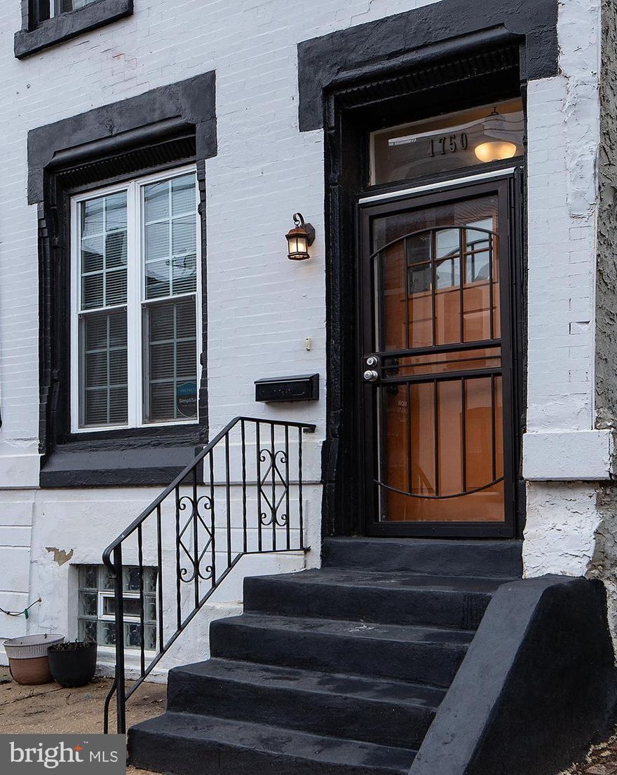 Welcome home to 1750 N. 25th Street, perfectly situated in the booming Brewerytown neighborhood. This fully renovated four bedroom, two-and-a-half-bath home blends classic Philadelphia charm with modern design and is move-in ready for its next owner.
From the moment you arrive, you’ll be drawn to the timeless brick facade accented by an ornate cornice. Step through the breezeway and into the open first floor, where soaring ceilings, hardwood floors, and a stunning exposed brick wall set the tone. The modern open-concept layout flows seamlessly into a beautifully appointed kitchen featuring a breakfast bar, all-new stainless steel appliances, and ample storage. A convenient half bath and pantry are tucked neatly toward the rear of the home.
Out back, enjoy a generously sized fenced yard with western exposure—ideal for summer evenings, entertaining, or relaxing BBQs.
The second floor offers even more character with additional exposed brick, a decorative fireplace mantel, three bedrooms, and a full hall bath. The third floor is dedicated to the spacious primary suite, complete with two closets and a private full bathroom, creating a peaceful retreat.
Located in a growing and thriving community, this home also features a 10-year tax abatement and offers easy access to I-76, Center City, and all that Brewerytown has to offer. Don’t miss this opportunity to own a beautifully renovated home in one of Philadelphia’s most convenient neighborhoods.