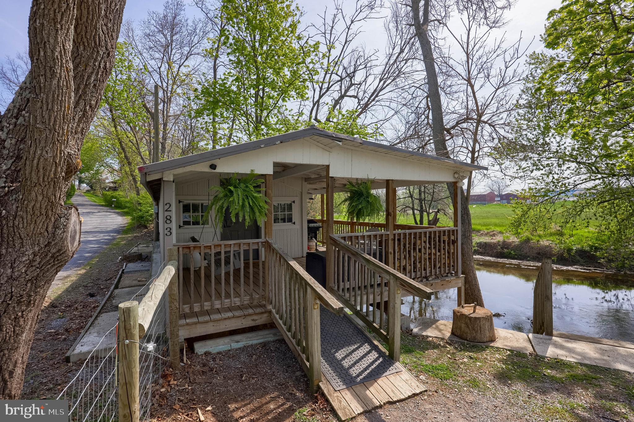 Peaceful Creekside Retreat in Brownstown – Ideal for Camping or Vacation Rental
Welcome to your getaway by the Cocalico Creek! This unique 0.75-acre parcel offers a tranquil setting perfect for weekend camping, kayaking, fishing, or simply enjoying nature. Currently used as a vacation rental, the property features an open camping shelter equipped with a kitchenette, futons for sleeping, an A/C unit, and a space heater—making it a cozy retreat in any season.
All furnishings are included, so it's ready to use or rent out immediately. While there is no well or septic, the property provides a rustic, back-to-nature experience just minutes from Rt 222 and only 15 minutes from Lancaster.
Please note: Do not enter the property without a scheduled appointment. Drive-bys are welcome.