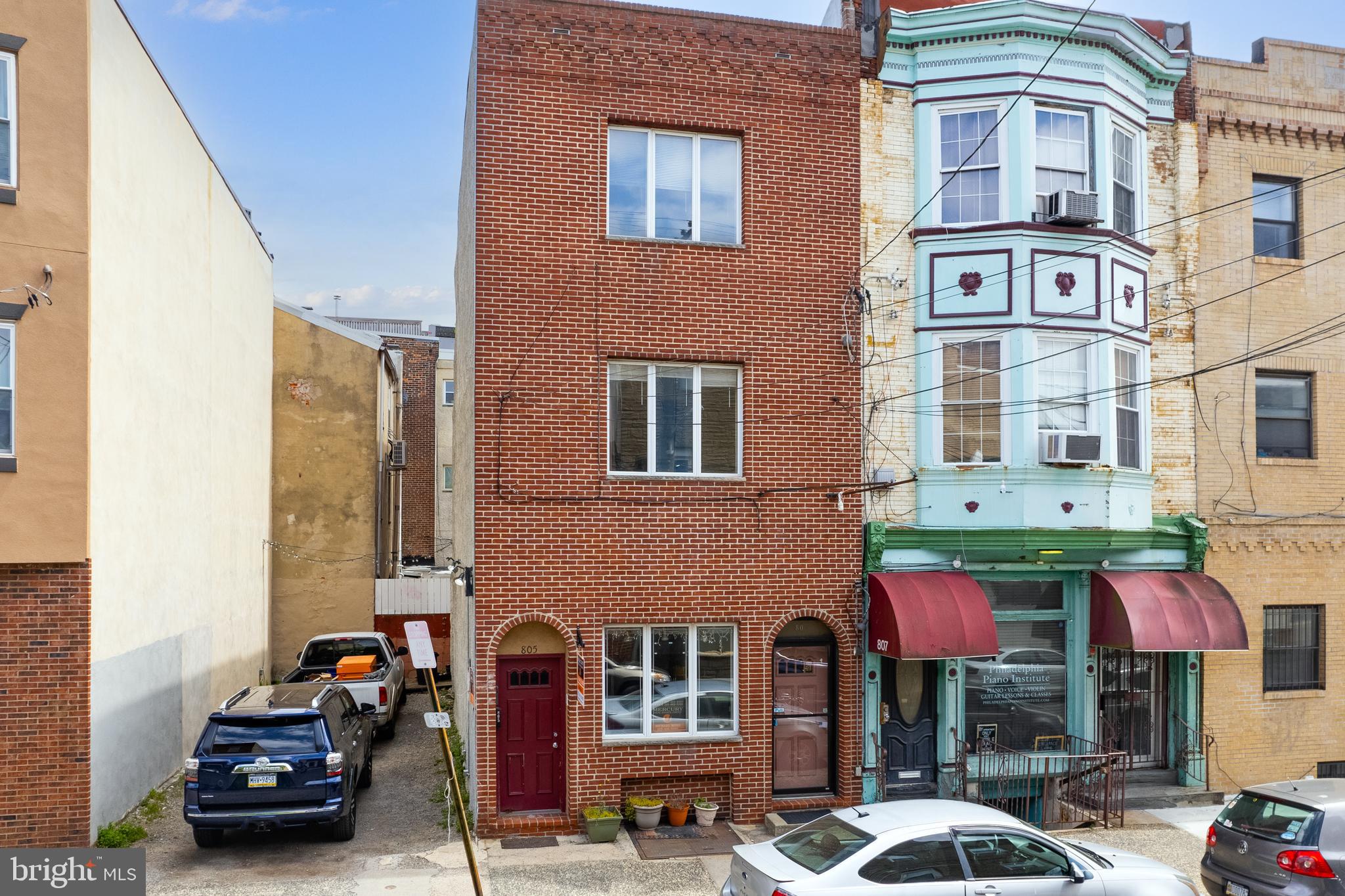 This commercial triplex features two two-bedroom, one-bath units. It is located between the Bella Vista and Queen Village neighborhoods of Philadelphia. Perfect for investors or owner-investors! The first-floor commercial space offers a large open floor plan, a half bath, and a private yard, making it an excellent option for a professional office. The 2nd and 3rd floors feature two large, two-bedroom apartments with full bathrooms, ample closet space, large eat-in kitchens, and plenty of natural light. The property is just minutes from the 9th Street Italian Market, the Broad Street Line subway, and the restaurants and shops in Passyunk Square. Schedule your showing today!
*** PLEASE NOTE: 805 S 8th St. and the vacant lot next to it at 803 S 8th St. (Land - MLS# PAPH2355892) MUST BE SOLD TOGETHER."