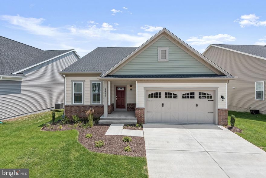 This beautiful Craftsman-style home is conveniently located in the Riverview Community of Two Rivers! Arrive into the main level of this brick and vinyl siding home by way of the foyer or two-car garage. The foyer welcomes you with crown molding, a chair railing, and box wainscoting that continues into the formal dining room or private office with French doors. An open floor plan allows for many possibilities featuring a gas-burning fireplace soaring ceilings, and luxurious laminate flooring. Let the kitchen inspire gourmet dining boasting a center island with a breakfast bar, stainless steel appliances, a pantry, 42” soft close cabinetry, and granite counters. Relax and unwind in the primary bedroom suite adorned by plush carpet, double vanity, a ceramic tile walk-in shower, and double walk-in closets. Two main-level bedrooms with a full bath and an upper-level bedroom and bath complete the sleeping quarters. The family room offers a space for a media area, an additional living area, or a recreation room that allows for spending time with family and friends.  Enjoy morning coffee, tea, or evening cocktails on the rear screened-in porch that overlooks the landscaped grounds for a truly tranquil atmosphere.  Amenities are in abundance with an in-ground pool, sports court, clubhouse, dog park, walking trails, tennis courts, outdoor community firepit and patio, and a pavilion. Major commuter routes include MD-3, md-175, I-97, and MD-32 for convenient travel to points of interest located north or south.