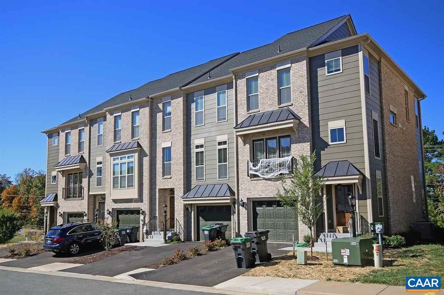 Available May 16th - This spacious 4 bedroom, 3.5 bath end-unit Avinity townhome is located off of Avon St Ext. and offers convenience to the Carter Mountain Orchard, Piedmont Community College, I-64, 5th St Station, downtown, and the UVA Medical Center. Enjoy Carter Mountain views and access to the community clubhouse with fitness equipment.  The 2,171 sqft townhome features an open and light-filled interior, luxury vinyl plank and carpeted floors, contemporary metal staircase railings, a full-size washer and dryer, a rear deck, and an attached 1 car garage.  The main level of the home offers an open concept which includes a living room, a half bath, a gourmet kitchen with quartz countertops, a tile backsplash, stainless appliances, and a 9? island, plus a sunny dining area. The top level includes a primary bedroom with a walk-in closet and a private bath featuring a walk-in shower with double shower heads. Two additional bedrooms, a shared full bath, and the laundry area are located along the hallway. The lower walk-out level offers the 4th bedroom and a full bath, plus access to the garage.  Occupancy is limited to no more than 3 unrelated individuals. No undergrads. *Photos shown are similar to the unit that is available.