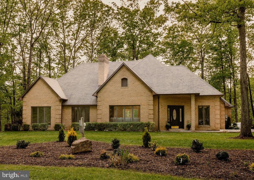 Welcome to your dream home! Situated on a wooded lakefront lot, this charming  ranch-style residence, has been renovated from top to bottom,  offering a perfect blend of comfort and functionality. Absolutely  an ideal choice for anyone seeking a warm and inviting space to call their own. With 2000+ square feet of thoughtfully designed living space, this home features three spacious bedrooms , providing ample room for relaxation and privacy. As you step inside, you’ll be greeted by a striking living room with vaulted ceiling and fireplace accent wall, perfect for creating memorable moments with loved ones during chilly evenings.  The dining room features a full wall of windows, bringing the beauty of the wooded lot inside while you dine.  The only word for the kitchen is WOW!  Striking dark cabinets contrast with white granite counter tops.  Top of the line appliances are a chef's dream.  The coffee bar adds a convenient touch for those busy mornings.  The exterior of the home is equally appealing, showcasing a classic brick façade that exudes timeless charm. The side-entry attached garage, complete with a garage door opener, offers convenience and easy access, ensuring that you can come and go with ease. Walk from your private rear patio through the wooded lot to your own lakefront access.  The expansive lot provides a blank canvas for your outdoor aspirations. Imagine creating your own garden oasis or a serene outdoor retreat where you can unwind after a long day. The community benefits from well-maintained common areas and road maintenance, allowing you to enjoy a worry-free lifestyle. Located in a peaceful lake centered neighborhood, this home is perfect for those who appreciate a tranquil setting while still being close to local amenities. Whether you’re looking to explore nearby parks, shops, or dining options, everything you need is just a short drive away. This property is not just a house; it’s a place where memories are made and cherished. With its inviting design, exceptional features, and unequaled quality, this home is ready to embrace its new owners. Don’t miss the opportunity to make this outstandingl residence your own. Schedule a viewing today and step into a lifestyle of comfort and warmth!