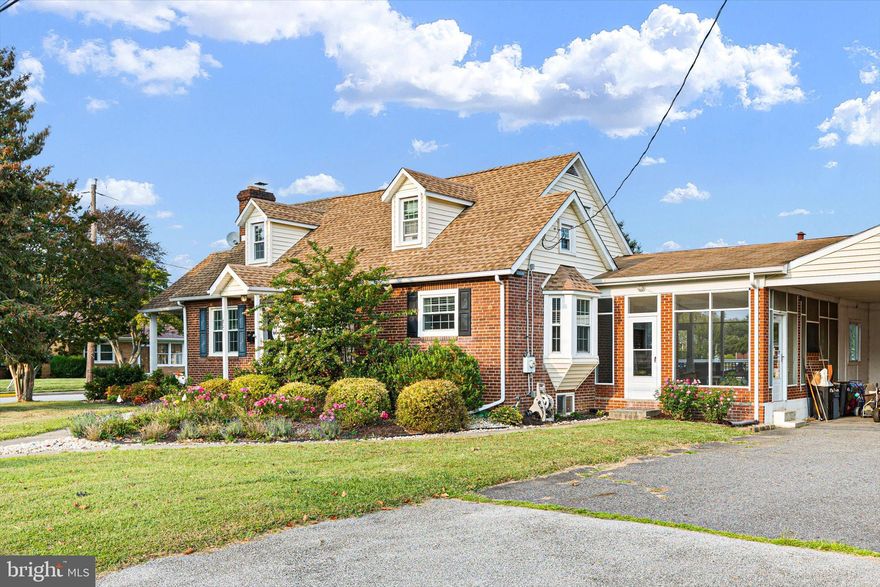 Beautifully updated 4-bedroom, 2-bath Cape Cod situated on a spacious 0.36-acre corner lot in the heart of Middletown.  Perfectly located within walking distance to Appoquinimink schools, Main Street shopping, and all that downtown Middletown has to offer, this home blends timeless charm with modern updates.  The stately brick exterior, lush landscaping, and split sidewalks set the tone as you approach, with two covered entrances providing convenient protection from the elements.  Nearly every aspect of this home has been updated over the past decade, including a modern open-concept kitchen, renovated bathrooms, architectural shingle roof, newer windows, furnace, and interior paint throughout.  Inside, gleaming hardwood floors flow through the living room, dining area, hallways, and bedrooms. The stunning kitchen boasts 42” shaker-style cabinetry with crown molding, granite countertops, stainless steel appliances, tiled floors and backsplash, and a peninsula with bar seating.  The kitchen opens to a bright living area anchored by a brick fireplace. The main level features two spacious bedrooms and an updated full bath, while the upper level offers two additional bedrooms, a renovated full bath, and a versatile flex space. The walk-out basement expands your options for future finishing potential.  Outdoor living shines here—step from the kitchen into a large screened breezeway with epoxy-coated floors, ceiling fan, updated lighting, and a built-in brick grill for bug-free summer evenings.  Prefer the sun?  Relax on the newer Trex deck overlooking a landscaped backyard bordered by Rose of Sharon and Crepe Myrtle trees.  The property also includes a two-car enclosed carport that can easily be converted into a garage, along with driveway parking for up to four additional vehicles.  With its prime location, thoughtful updates, and charming outdoor spaces, this Middletown gem is a must-see!