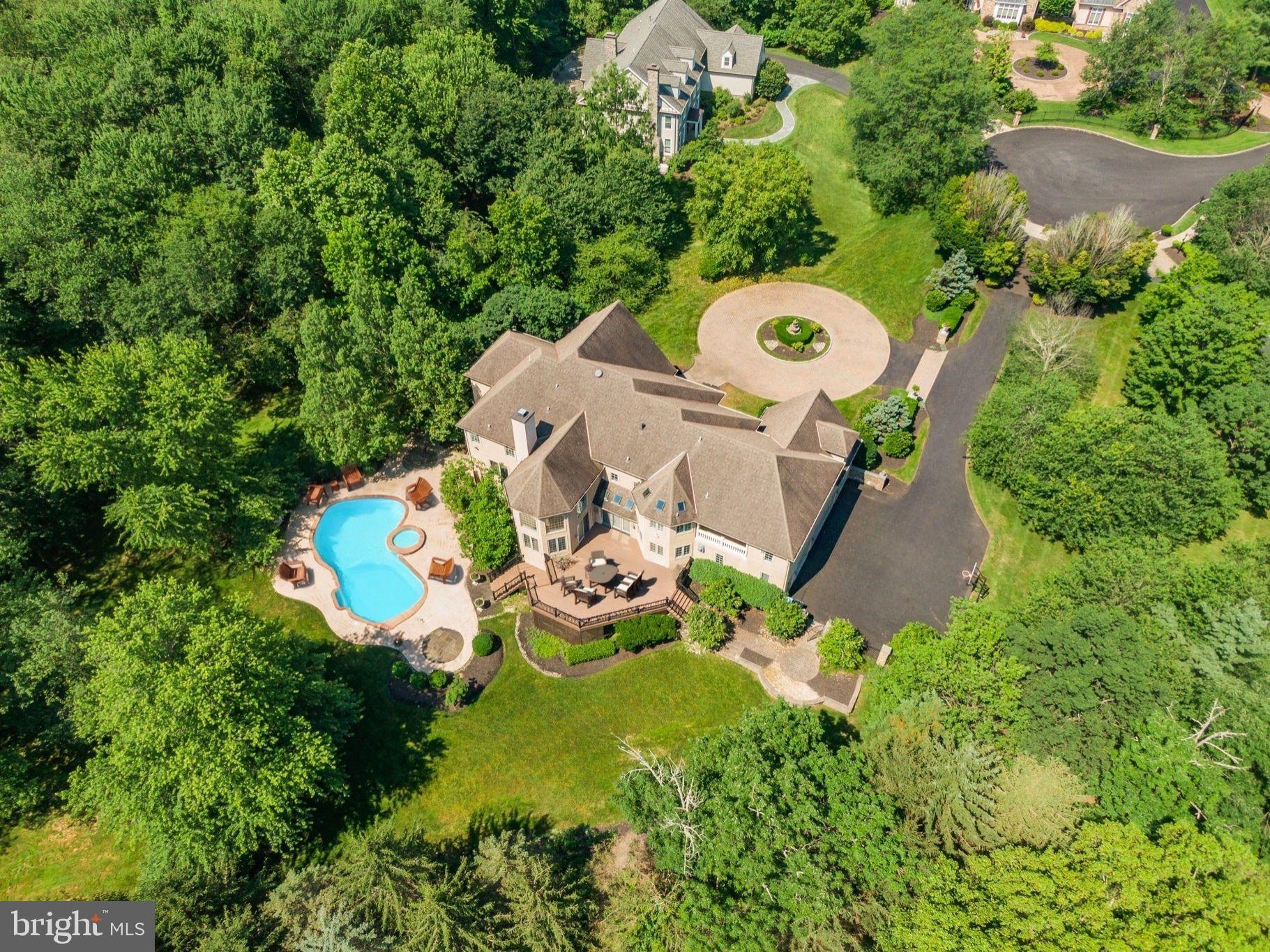 Meticulously Maintained, MoveIn Ready & Freshly Painted Custom Home in Lower Gwynedd Township, Total of 9,880 Square Feet of Living Space; Check Out The New Look; This Home is Great for Relocation Buyer or Buyers Looking For a Timely Move-In Date; Located on a Private Four-Home Cul-de-Sac, Home Backs to Acres of Mature Woods, a Very Private Living Experience; Great News! If You Require an InLaw Suite or Private Living For a Family Member; Your Search is Over! Check OUt the Expansive, Above Ground, Walkout Lower Level with Over 2,680 Finished Square Feet, with Full Living Quarters Including a Kitchen, a Bedroom or 2, Tons of Storage, 2 Private Entrances and its Own Parking Space in the 4-Car Oversized Garage; Currently the Lower Level is Set Up with a Bedroom, a Gym, a Media Room, a Playroom, a Full Bath and a 2nd Laundry Room; Perfect for Use as an Inlaw Apartment, Caregiver Suite, Home Business, or a Wonderful Place to Entertain Friends and Family, It’s a Kids Paradise, Big and Little! The Above Ground Living Space is 7,200 Square Feet and Was Expanded Beyond the Public Records, all Building Plans are Available; Features Include 10-Foot Ceilings, Recessed Lighting Throughout, 5 Fireplaces, Maintenance Free Exterior, Tons of Windows For Natural Light, 2nd Floor Laundry Rm and More! A Circular Driveway Leads to a Grand Two-Story Marble Foyer with a Curved Staircase; The Formal Living Room Features a Gas Fireplace While the Large Dining Room is Perfect for Entertaining; The Two-Story Family Room is Spectacular with Floor-to-Ceiling Windows, a Fireplace, and New Carpets; Expansive Chef’s Kitchen is Complete with Tons of Granite Counters, Sub-Zero Refrigerator, Double Ovens, 6-Burner Range with Griddle, Trash Compactor, Custom Range Hood, Built-In Desk, and a Massive Island with Bar Stools; The Spacious Breakfast Room with Sliders to the Rear Deck, Creates the Ideal Indoor-Outdoor Entertaining Experience; Also on the Main Floor: a Private Office w/Hardwood Floors, Built-Ins, a Refrigerator w/a Sink, a Butler Pantry with Tons of Cabinets, Mini Refrigerator and Sink, a Stunning Conservatory with Fireplace and Floor to Ceiling Window Surround, 2 Powder Rooms, and 2 Stairways to the Second Floor; Upstairs, Discover 5 Generously Sized Bedrooms Including a Grand Primary Suite with Sitting Room, Fireplace, Dual Walk-In Closets, and a Spa-Inspired Bath with Marble Floors, Jacuzzi, Frameless Glass Shower, 2 Separate Vanities and a Private Comode Area; On the Right Wing, There are 3 Bedrooms, One with a On-Suite Full Bath, and the Other 2 Share a Full Bath; Princess Suite BedRoom with a WalkIn Closet is Across from the Expansive Laundry Room; The Bedrooms and Bathrooms Provide Ideal Layouts for Families or Guests; A Walk-Up Attic Offers Additional Storage or Future Finished Living Area; The Oversized 4-Car Garage with Ample Built-In Storage; Truly a Move-In Ready Custom Home with Modern Systems, Exceptional Upgrades, and a Flexible Floorplan Designed for Today’s Evolving Needs; HVAC Units Have Been Updated, See Agent Hub and Disclosure; This Custom Home was Pre-Inspected, the Report is Included In the Documents; The Stucco is Maintenance Free, New Stucco Was Installed 7 Years Ago Which Included the Full Removal and Replacement of the Original Stucco with Cement-Based, Drainable Stucco Featuring an Integrated Moisture Barrier System for Maximum Longevity and Peace of Mind; At the Same Time, the Rear Deck Was Completely Rebuilt and Enlarged Using Maintenance-Free Trex Decking; This Created an Expansive Outdoor Space That Captures the Afternoon Sun and Overlooks the Lush Backyard and Pool Area Below; The Pool is Currently Needs Repair, See Downloads & Agent Hub For Pool Details; Minutes from Major Routes, Shopping, Dining and Country Clubs,Yet Tucked Away in Complete Seclusion; This Is One of the Best Luxury Opportunities Priced to Sell! Check Out Zillow Showcase For 3D Photos and the Floor Plan;
