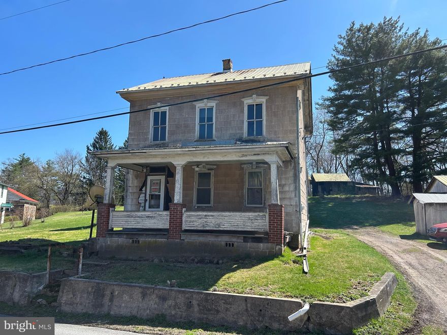 Lonely home is waiting for you! Here is your chance to restore/renovate a country style farm house. The staircase to the 2nd floor has beautiful railings that curve and flow right to the attic entry door. Ceiling height on both floors is over 8 feet. The kitchen appears to be original, restore it or replace it. There is a first floor bedroom with 2 other  bedrooms on the 2nd floor. Bathroom is on the 2nd floor. Demo has already begun in the main level living room.  Lot is gently sloped and contains .60 of an acre. There are several out buildings on the property including an outhouse and a detached garage.  You've watched all the home shows, now it's your turn to show what you can do!