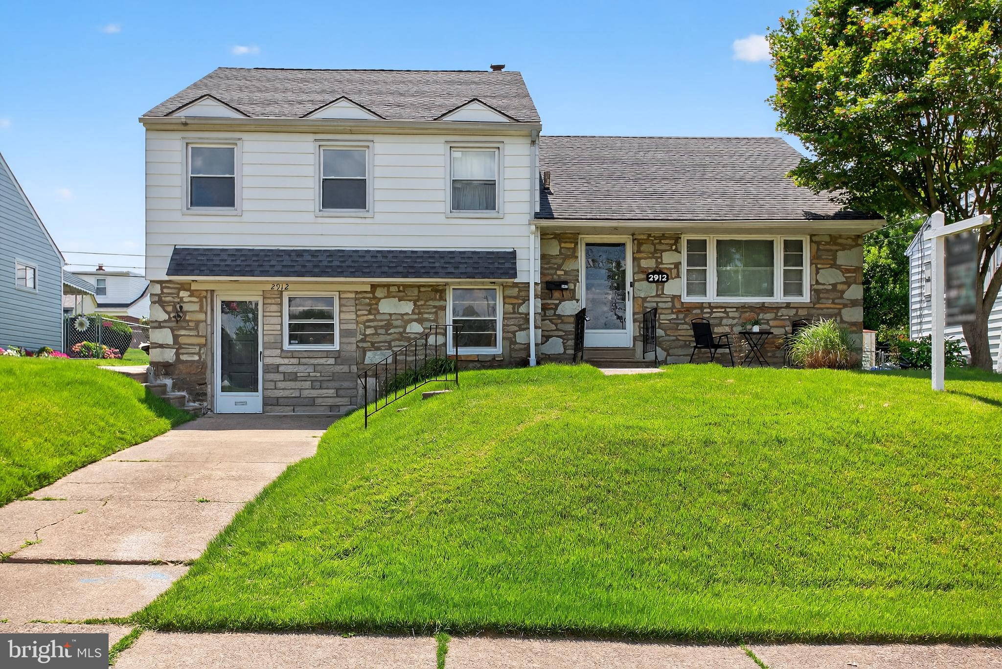 Welcome to 2912 Holme Ave! Located in the heart of desirable Winchester Park, this spacious 4-bedroom, 2.5-bath split-level home offers a thoughtful layout and plenty of room to grow. Step inside to find updated flooring throughout the main level, a formal living room, and a separate family room—giving you flexible spaces for both everyday living and entertaining. The kitchen is bright and functional, featuring stainless steel appliances, a breakfast bar, updated countertops, and ample cabinetry. A formal dining area just off the kitchen adds the perfect touch for hosting dinners and gatherings. Upstairs, the primary suite provides a private retreat complete with an ensuite bath and walk-in closet. There are three additional spacious bedrooms and an attic space ready to be transformed into a fifth bedroom. Downstairs, the expansive lower level stands out with additional living space, including a built-in bar—great for hosting friends or creating your own hangout zone. Outside, enjoy a spacious, covered back deck that overlooks the yard, plus a shed for extra storage. With modern updates, a smart layout, and a well-maintained feel throughout, this home is truly move-in ready. Located just minutes from Pennypack Park trails, schools, shopping, and major commuter routes (I-95, Roosevelt Blvd). Don’t miss your chance to own a home with this much space, charm, and versatility.
