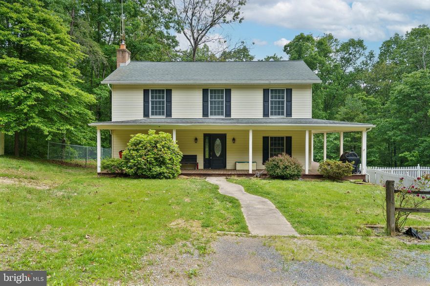 Back on Market—No Fault of Buyer, Seller, or Property! Nestled on 5.19 private acres in the Timber Ridge subdivision (No HOA!), this charming property offers space, privacy, and a peaceful lifestyle. With 3—possibly 4 bedrooms—and 2.5 baths, the home features a spacious living/family room with a cozy woodstove, perfect for relaxing or entertaining.

Upstairs, the primary suite provides a tranquil retreat with a soaking tub, separate shower, and walk-in closet. Beautiful oak flooring enhances the main level, and French doors lead to a rear deck overlooking your own heated, in-ground swimming pool—ideal for summer enjoyment.

The home does need updating, presenting a great opportunity to add your personal touch and increase value. Whether you're looking to modernize or customize, this property has solid potential.

Additional highlights include a detached three-car garage with an attached recreation room, a tractor shed, and several versatile outbuildings for storage or hobbies.

Ideally located just 20 minutes from I-81 and Berkeley Medical Center, this property is also close to an MX motocross track, local breweries and distilleries, The Woods Resort, and charming historic towns and sites. Enjoy the perfect balance of seclusion, recreation, and convenience—ready for you to create your dream retreat.