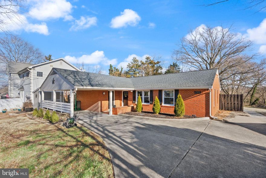 OPEN SUNDAY 1/11/25 1-3pm. Fully renovated brick rambler offering four bedrooms and exceptional modern upgrades in the highly desirable Virginia Hills community. With renovations completed in 2021 and  additional improvements in 2022, this 1,532-square-foot home showcases quality craftsmanship, functional design, and an unbeatable location just minutes from I-495, I-295, I-395 and the Huntington Metro Station.
Inside, an open floor plan seamlessly connects the living, dining and kitchen areas, creating a bright and cohesive flow ideal for both everyday living and entertaining. The adjacent sunroom features large picture windows with beautiful views of the expansive yard and a modern wood-burning fireplace, creating an inviting spot to unwind throughout the year.

The updated kitchen includes white cabinetry, upgraded countertops, stainless steel appliances and a gas range. In 2022, a breakfast bar, additional kitchen cabinet and sunroom storage cabinet were added, providing extra seating, storage and counter space. Four well-proportioned bedrooms offer flexibility for guests, a home office or additional living space. Both full bathrooms have been updated and feature glass doors, a sophisticated black-and-white design and modern finishes.

The home has benefited from extensive system and structural improvements (2021), including a new roof, all-new windows, upgraded interior and exterior lighting and a tankless water heater. A Samsung full-size front-load washer and dryer (2022) further enhance convenience. Every major component has been thoughtfully upgraded to ensure efficiency, comfort and peace of mind.

Outdoor living is a standout feature. The current owner has greatly improved the backyard with landscaping, including privacy trees along the fence line, as well as a custom hardscape patio and retaining wall that expand the usable outdoor space and create an ideal setting for entertaining. The level lot backs to mature trees, offering both beauty and privacy. A concrete driveway accommodating up to four vehicles and an attached carport complete the exterior.

Ideally located just minutes from Old Town Alexandria, Washington, D.C., Amazon’s HQ2 and major shopping destinations including Pentagon City, Springfield Town Center, Tanger Outlets and MGM. This home offers exceptional access to the best of Northern Virginia. *Some furniture can convey as requested. Ask listing agent. *