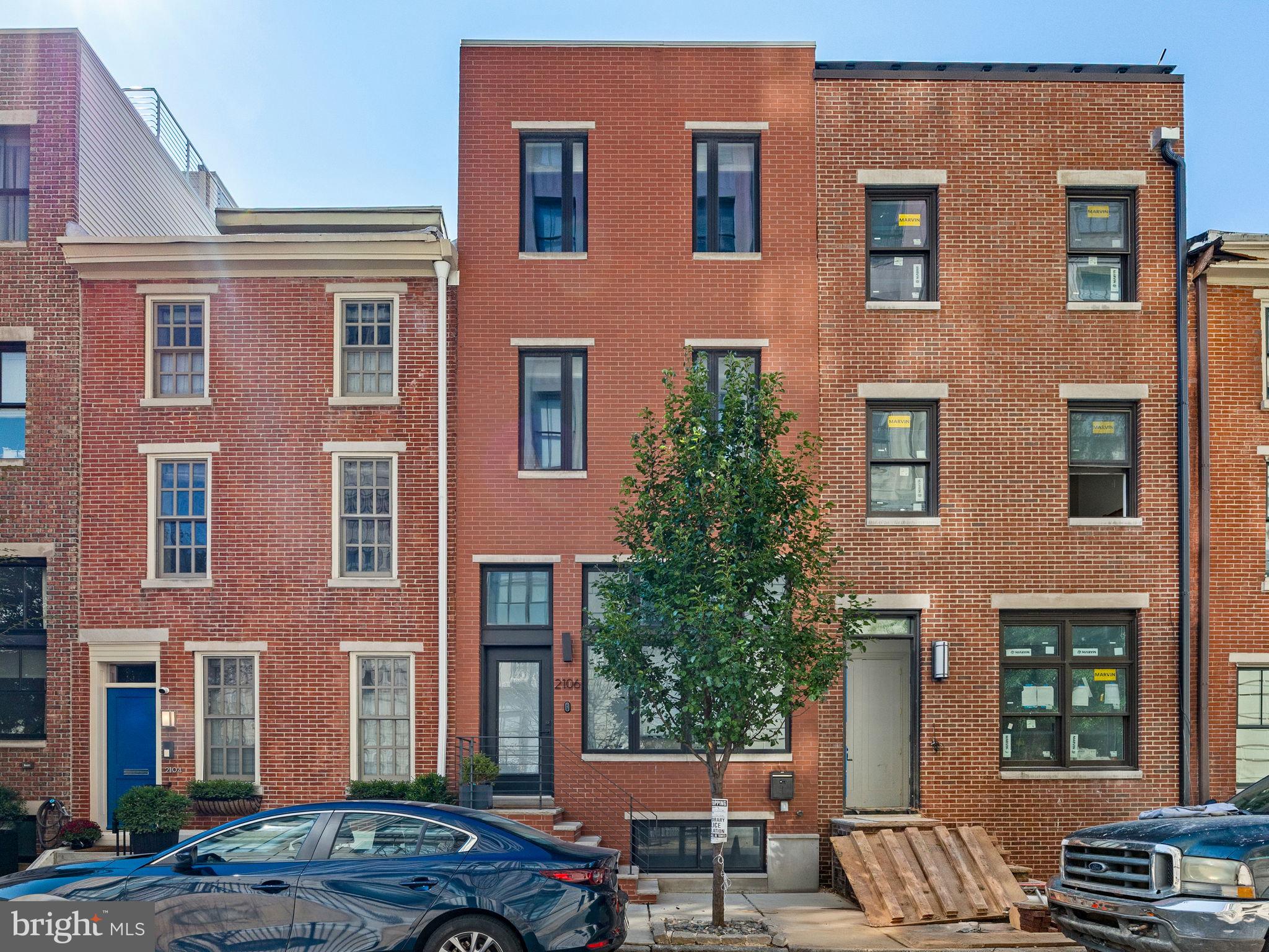 On a quiet, tree-lined street, this stunning 4-bedroom, 4-bath townhome blends historic character with modern luxury. New construction in 2019, the home features soaring ceilings and an exposed brick wall preserved from the original c.1880 structure.
The open-concept first floor flows through to a chef’s kitchen boasting marble countertops, premium stainless appliances, and abundant natural light. A fenced backyard with stone patio offers the perfect spot for morning coffee or outdoor dining. On the second floor, two spacious bedrooms feature generous closets and en-suite bathrooms, while a laundry and utility closet are discreetly tucked away on the landing. The third-floor primary suite is a private retreat with dual closets, a Juliet balcony, and a spa-like bath with jacuzzi tub and dual-head rain shower. A rooftop deck with unobstructed Philadelphia skyline views makes an ideal space for entertaining or relaxing. The finished basement provides a flexible space for a media room, home office, or guest suite, complete with an en-suite bedroom. Permitted parking in the lot at the west end of the block will be transferred to the new owner. The current owners made premium upgrades throughout the home with features including custom millwork and cabinetry, Pennsylvania bluestone patio, luxury light fixtures, and Farrow and Ball low VOC paint.
Perfectly situated in Logan Square, 2106 Spring St. offers the best Philadelphia has to offer with the city's museums, top restaurants, parks and river trail all within a short walk. At the same time, convenience is maximized with a Whole Foods, Trader Joes, and Giant Heirloom Market around the corner, easy access to major highways and 30th Street Station just a a 10-minute trek. Incredible for commuting to NYC or popping out to the Main Line. Located in the Albert Greenfield catchment, this home is also steps from top private schools, the Franklin Institute, Boathouse Row, and the upcoming Calder Museum.
With a property tax abatement in place through 2029, this home offers a rare mix of luxury, location, and long-term value. Spring Street is a treasure in Philadelphia’s most sought-after neighborhood with a vibrant community of accomplished civic and business leaders, artists, doctors, and young families alike.