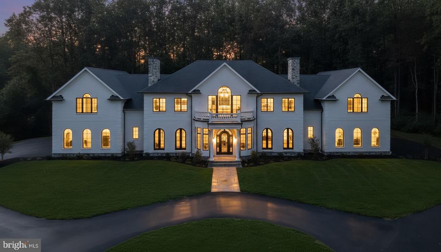 Bespoke home. Every element carefully curated. Welcome to a luxurious haven, a 65-acre estate where elegance and sophistication await. The property opens with a grand circular driveway, leading you to dual garages, an ode to design and functionality for the true automotive aficionado. Step inside to discover majestic 10-foot ceilings and the inviting glow of Brazilian chestnut floors. Throughout the home, custom crown molding and exquisite Schonbek lighting emphasize the artisanal craftsmanship and attention to detail that defines this residence. Five stunning fireplaces with slate hearths are thoughtfully positioned throughout the home, offering warm and inviting spaces that serve as the perfect focal points for relaxation and gathering. The centerpiece of the home is the kitchen—a chef's dream come to life. Elegant Taj Mahal quartzite countertops marry beautifully with top-of-the-line Wolf and GE Monogram appliances. A complementary butler's pantry offers additional ovens, a second sink and dishwasher, and abundant cabinet space, ensuring you're ready for everything from casual family breakfasts to lavish dinner parties. This home boasts seven stunning bedrooms, each a sanctuary of comfort and style. A highlight is the private bespoke suite, crafted to provide comfort and privacy for caregivers or anyone needing an extended stay. There’s also the potential for an eighth bedroom on the main level, offering even more adaptability for your lifestyle. The owner's suite is truly exceptional, designed as your personal retreat within this grand residence. It features two separate ensuites for ultimate luxury and privacy, offering spa-like experiences complete with the finest finishes and amenities, redefining comfort and relaxation for you and your partner. Descend into the thoughtfully designed finished basement, where you'll find a guest bedroom with additional sitting space and an en-suite, perfect for extended visits or private stays. This versatile lower-level also includes a media room, a playroom, and even a dedicated pet bath, ensuring every family member—from the youngest to your furry companions—feels catered to. Your outdoor adventures await, where natural beauty takes center stage. A tranquil river meanders through the property. Explore the extensive network of hiking and riding trails weaving through the stunning landscape. The abundant flora and fauna provide a dynamic, ever-changing backdrop. This meticulously crafted home invites you to reconnect with nature and experience supreme efficiency. At its core is an advanced geothermal heating and cooling system with five independent units and seven zones, ensuring personalized climate control and minimal energy use. Enjoy year-round fresh, purified air through the energy recovery ventilation (ERV) system, enhanced by two April Aire 800 steam humidifiers for ideal humidity levels. Geothermal hot water heaters paired with a 100-gallon storage tank ensure ample hot water supply, while a substantial 600-amp electrical service, backed by a Kohler transfer switch ready for the addition of a 26kw generator, guarantees consistent power. Water flow is facilitated by constant pressure well water, instant hot water availability, and a comprehensive water treatment system, including a water softener. The home's energy efficiency is complemented by spray foam insulation, and a discreetly buried 1000-gallon propane tank provides ample fuel. Future enhancements are supported with electric conduit for a gate, propane rough-in for an outdoor kitchen, and additional exterior outlets and hose bibs. This all-brick estate offers abundant privacy and yet is close to world-class healthcare and easy access to Washington DC and New York City via train or I-95. This estate is more than just a home; it’s an invitation to live luxuriously and create lasting memories. Embrace the unparalleled beauty and endless potential of your new sanctuary. Welcome to your exquisite legacy.