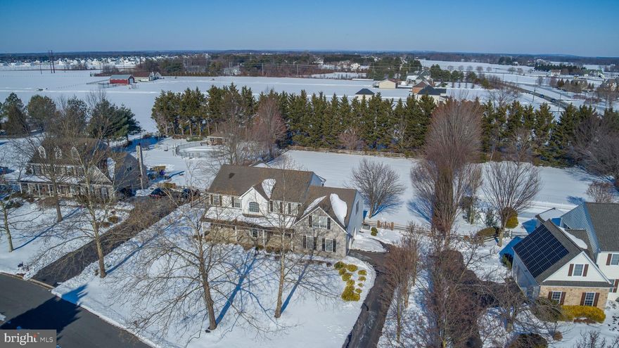 This stunning executive home located in sought-after Westside Hunt and the Appoquinnimink School District offers casual elegance, almost 5000 square feet of living space, and fine craftsmanship by Desabatino Construction.  This home features a beautiful stone facade, gracious covered porch for morning coffee or relaxing afternoons, gleaming hardwood floors, 9' first floor ceilings, an ample familyroom with cozy gas fireplace adjoining the generous kitchen with center island, great pantry, newer stainless steel appliances, and a sunlit breakfast alcove overlooking the large deck and the expansive, fully fenced back yard. The two story foyer with handsome oak staircase takes you to the second floor where you'll find four comfortable bedrooms, three full baths, and a spacious 20 x 24 bonus room or 5th bedroom . The primary retreat offers a luxurious en-suite bath with huge soaking tub, walk-in shower and double vanity. The fourth bedroom/guest suite is complete with a private full bath and jetted tub.  The massive finished lower level with built-in bar is the perfect entertainment, media/gameroom, work or hobby space.  The two car garage is equipt with an EV charger and leads to a handy mudroom/drop zone for shoes and gear.  Other features include a new water heater, new carpet, newer A/C unit and a radon mitigation system. Nestled on .8 acres and conveniently located in peaceful and picturesque West Middletown this home offers easy access to restaurants, shopping, schools, marinas, YMCA, parks and outdoor recreation as well as the Rt. 301 bypass and Rt. 1 for a quick communte to points North and South.