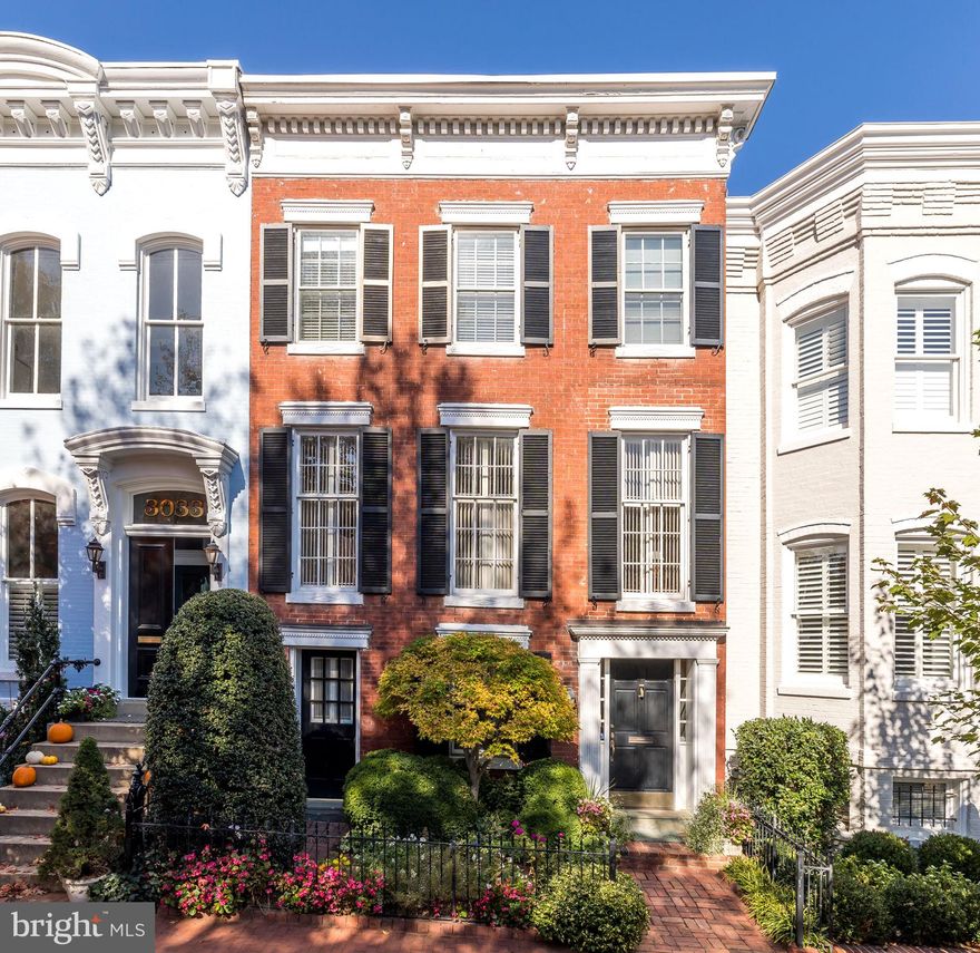 An exceptional East Village Opportunity!  Welcome home to this classic Georgetown Federal on one of the most popular blocks in the East Village.  This gracious 4 Bedroom / 3.5 Bath home spans more than 4,000 square feet and touts modern updates along with original details. Recent improvements by the previous owners include a new roof installed by Wagner Roofing, new LG washer/dryer, new Lennox HVAC, new hot water heater and gas fireplace insert.  The flexible floor plan features a large, entry level bedroom with exterior access making it perfect as a separate guest/nanny/in-law suite or home office. Tons of storage throughout.  Second floor boasts a stunning Living Room with gorgeous floor-to-ceiling historic windows affording all day southern sunlight, double fireplaces (both gas and wood burning) and custom cabinetry. Dining Room features spectacular cathedral ceiling with oversized skylight illuminating the entire living level. Kitchen opens to Family Room and includes new Quartzite countertops, new Subzero refrigerator, AGA range and Bosch dishwasher. A generous-sized family room opens to a charming deck overlooking a lush garden with mature annuals. Perfect for spring gatherings!  The third floor features 3 bedrooms and 2 bathrooms including an oversized Primary Suite with 4 closets and a double marble bathroom with an abundance of natural light from skylight above. Two additional bedrooms (both with fireplaces) plus a sunny hall bathroom complete the top level.  This is a special opportunity to own a piece of history on a superb block in the East Village.