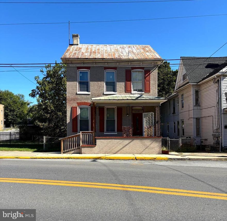 In search of an investment opportunity? Take a look at this 2 story colonial home located in Martinsburg, WV featuring a primary bedroom with an attached bathroom on the first floor, a spacious living room, kitchen, unfinished basement, 2 more bedrooms and another full bathroom upstairs. From the kitchen and out the back door there is a nice back deck with a ramp that makes the home handicap accessible. Although the home fronts the road, there is a driveway behind the home along with a detached 1 car garage. Just minutes from downtown, close to shopping, restaurants, major commuter routes and more. There is great potential here, schedule your showing today! Property is being sold AS-IS.