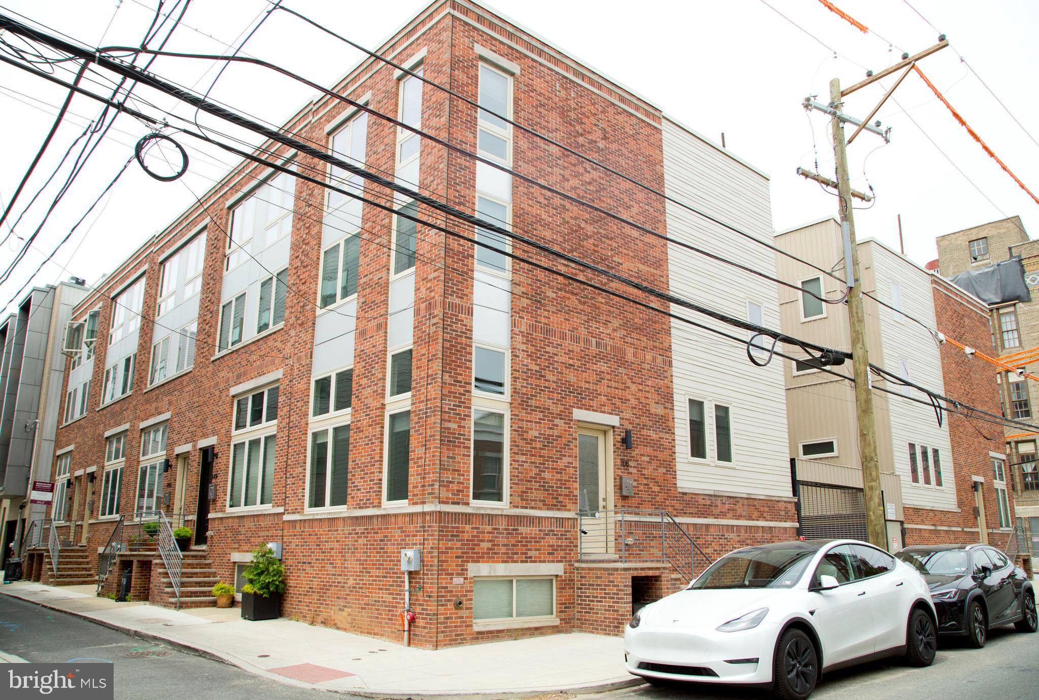 Welcome to 708 N 17th St in the bustling Art Museum neighborhood. This 3 bedroom, 2.5 bath, corner property is one of the largest in the 10 unit development with around 2200 sqft of living space. The home has hardwood flooring throughout, two zone HVAC system, custom blinds, gas range and a roof deck with City Views and gated off street parking! You can always drive to work or your errands and always have a spot to come back to! Boasting 15ft ceilings in the living room and large windows there is an abundance of natural light thru out the day. A floating staircase leads from the living area to a 1/2 bath and a nicely appointed kitchen and dining area that overlooks the living room. Making it easy to entertain with friends and family whilst working in the kitchen. With stainless steel Samsung appliances, Quartz waterfall counter tops, a tile backsplash and ample cabinet and counter space, the kitchen is well suited for all of your needs.
The 2nd floor has 2 well sized bedrooms, a hallway linen closet and a large hallway bathroom with a double vanity making it easy to share.
Encompassing the 3rd floor is a private primary suite with a custom walk in closet and a large boutique bathroom. Featuring a double vanity, a large soaking tub and a separate glass shower. it can be your own personal respite from a long day.
From the 3rd floor you have access to a wet bar and the roof deck with views of the city skyline. A perfect area to entertain.
The finished basement has 9ft ceilings, and can easily accommodate a home gym or a office space.
Situated half a block from Fairmount Avenue there are many neighborhood amenities within a short walk. Rybread, Stones Beverage, Fairmount Tavern, Bar Hygge, Coffee Cream & Dreams, Yoga, multiple gyms, Art Museum Vets, 2 Grocery Stores, Osteria and South to name a few.