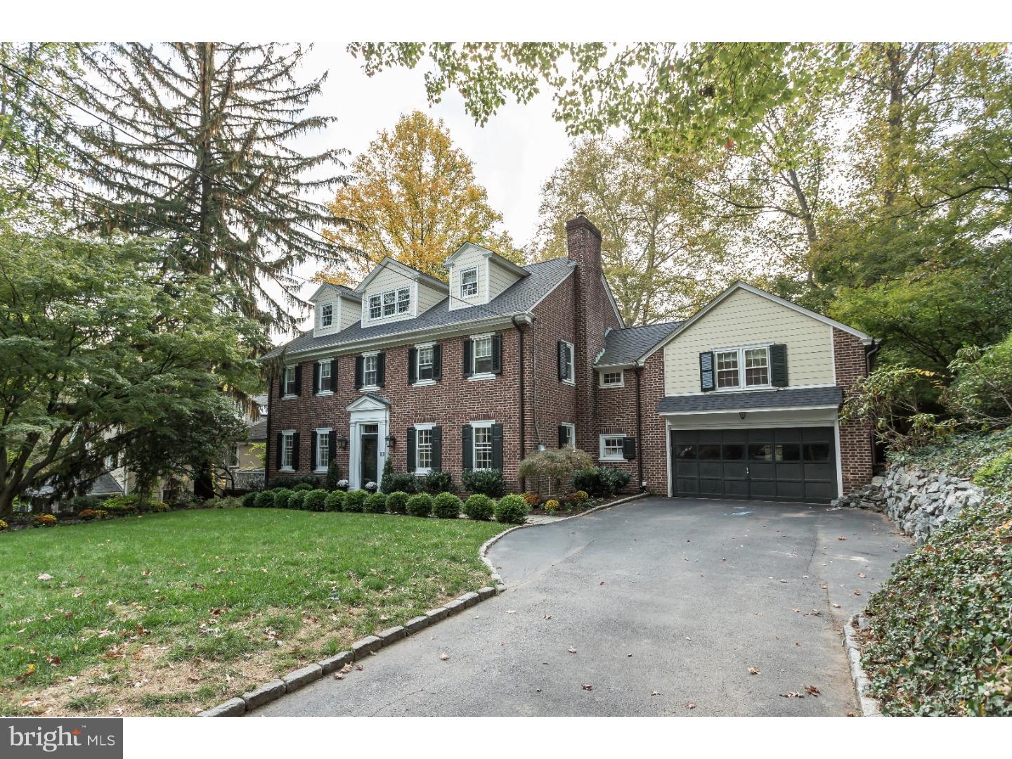 Classic Georgian Colonial ideally located on a sought after cul-de-sac in a fabulous walk to Wayne neighborhood. This home has a welcoming center hall, gracious Dining Room with built-in corner cabinets, large Living Room with fireplace and access to a private side covered porch, and a door to a bright sunroom/den with built-ins. The kitchen has stainless steel appliances, corian countertops, large island and opens into a family room with a cathedral ceiling, built-ins, large Palladian windows and sliding door to a flagstone patio that overlooks a large, level fenced in backyard. The first floor also has a powder room and mud room that accesses the two car attached garage. The second floor has a large Master Bedroom with a master bathroom, and two walk-in closets. There are three other bedrooms on this floor, two full bathrooms and a second floor laundry. The new open and sun-filled third floor has two large bedrooms and a new full bath. The lower level has been finished into a playroom with storage and a second laundry. This great house has been thoughtfully expanded and meticulously maintained. It is walk to Wayne with its great restaurants, shops, movie theater and train station.