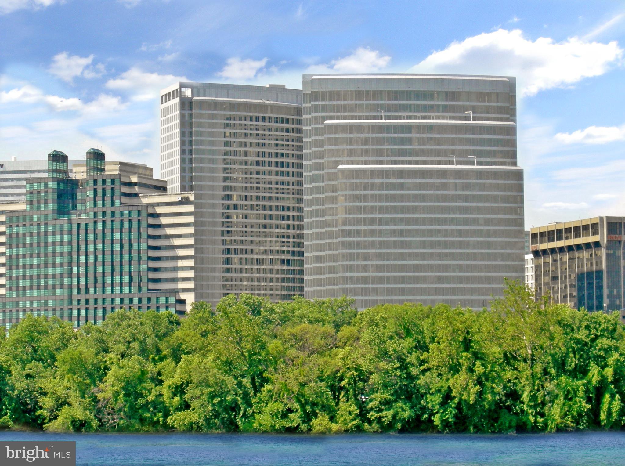 Immaculate corner, contemporary 1175 sq. ft unit offering two bedrooms, two baths and surround views of the river, Georgetown and downtown Rosslyn. Luxury features abound and include Wood Mode kitchen and bathroom cabinets, Viking oven and gas cooktop, Subzero refrigerator, GE microwave, Miele washer and dryer, gleaming hardwood floors in the living area, marble tiled bathrooms, floor to ceiling windows with privacy shades, walk-in closets, and one assigned parking space in the underground garage. Rent includes concierge and 24/7 front desk service, use of the hotel fitness center, gas, heating and water.
The Residences at Waterview is a stunning contemporary style building at the foot of Key Bridge overlooking the Potomac River in Rosslyn and designed by internationally renowned architects Pei Cobb Freed & Partners. The recipient of numerous design awards over the years, Pei Cobb Freed stand at the forefront of contemporary architecture, and are perhaps best known for their dramatic expansion and modernization of the Louvre in Paris. The Meridian Hotel occupies the first twelve floors of the building, and residents enjoy access to the facilities and services of the hotel including room service and the fitness center. The roof top terrace on the 31st floor, exclusively for residents, offers an opportunity to grill outdoors while taking in the magnificent world-class panoramic views of the city and Potomac River.
With its superb location just moments to Georgetown, DC, Reagan National Airport and one block to Rosslyn metro, Waterview offers the epitome of chic urban living. Note: Small pets on a case by case basis. Tenant responsible for $500 move-in fee and $500 refundable building security deposit. Minimum income to qualify – 2 incomes max.
