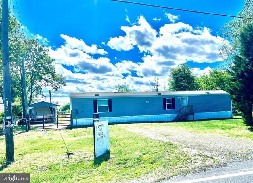 3 bedroom 2 bath home just outside of Delmar. 1/2  acre of land in a nice rural setting with easy access to the amenities of Delmar, Laurel and Salisbury. Low Delaware taxes, no hoa,