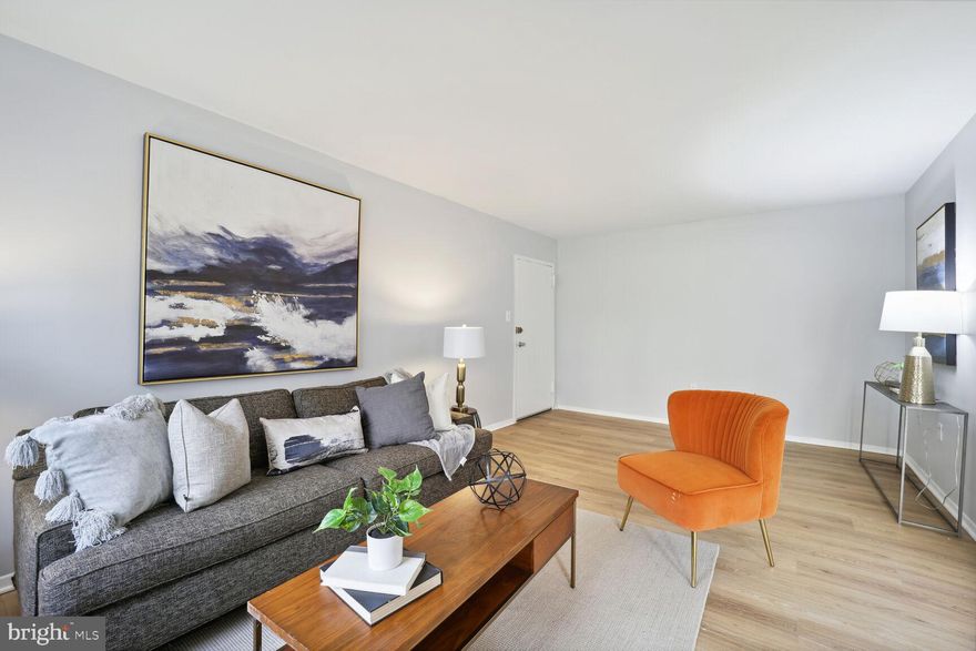 Best Value in the community!! Two bedroom 1 bath with over 1000 square feet. Seller has freshly painted, carpeted, installed new LVP flooring and prof. cleaned . Terrace walk-out level for all you dog & nature lovers. Great closet space..plenty of parking. Community pool & tennis. Condo fee includes ALL UTILITIES! An outstanding buy!!!