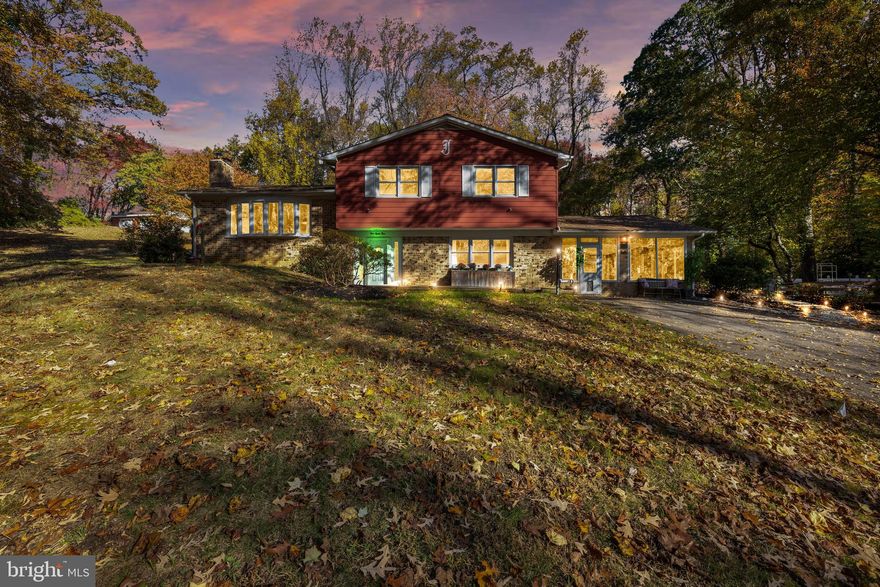 Tucked away in a private over one acre setting in the sought after community of Waterbury Heights in Crownsville! This split-level home offers over 2500 square feet of living space and character throughout. Step inside to find the original hardwood floors and an inviting original slate foyer setting a warm tone from the first step. The home features unique artisan brick work, 3 spacious bedrooms and 2 1/2 baths blending traditional and unique craftsmanship with some modern upgrades. 

Major systems including the roof in 2020, have been maintained and upgraded for peace of mind. The septic system was replaced along with a new French drain system and additional sump pump were added in 2014. The air handler unit was replaced in 2020 along with the oil burning boiler system and water heater both replaced in 2022.  The fireplace and fire boiler flues were both replaced in January 2024.  The water system has been regularly serviced and maintained, with major components upgraded within the last 5 years. 

The spacious kitchen and dining area welcomes large family gatherings with the dining area having seating for 12 or more.  The kitchen has a double wall oven and a LG smart dishwasher for your convenience.  

This home offers double-pane tilted windows make cleaning easy while boosting efficiency. 

A whole house propane generator recently serviced enables reliable power year-round.

Enjoy outdoor living on two large decks each with electric service perfect for entertaining or relaxing. The 49x16 deck leading to the back yard off the great room provides plenty of room for gatherings.  Enjoy the fire pit and peaceful patio, both perfect for outdoor peace and relaxation. 

The rear of the property also features a 20x20 workshop equipped with air-conditioning, built-in cabinetry, workbench and television along with Anderson windows. A separate concrete storage shed is also available for added storage.  Also included is a hard wired invisible fence to keep your furry family members close by; just bring your own transponder.

 A highlight of this property is a stunning fireplace mantle originally from a historic Maryland tobacco farm, offering a rare touch of local history and charm. Generous parking and long driveway with detached steel-framed 16x20 1- car garage and plenty of street parking are also featured.

This is a truly unique home that combines character comfort and convenience - all in an exceptional Crownsville location close to major routes and shopping.

This home is located only 40 minutes to D.C., 30 minutes to Baltimore and only 15 minutes to Annapolis are the nearest MARC train station