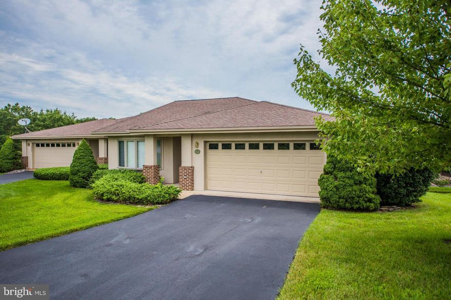 Must see two level patio home at The Woods Resort. Spacious, open and full of light offering 4 bedrooms and 3 full baths. Master on main level. Huge living room with vaulted ceilings,sky lights and gas FP.  Great sun room overlooking golf course. Large kitchen w/ breakfast area and separate dining room. Lower level has a rec room, 2 bedrooms and full bath.