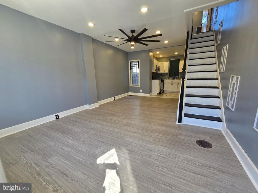 Beautifully rehabbed 2 bedroom home on a quiet block.  This home is clean and has a luxury feel.  Home features new hardwood flooring throughout, new kicthen,  new bathroom and all new appliances. First floor has a very calming color scheme with beautifully tiled kicthen and hardwood living room. 2nd floor has 2 nice sized bedrooms and beautiful large bathroom.  Lower level is clean , has plenty of storage space and brand new washer and dryer.  Outside areas include