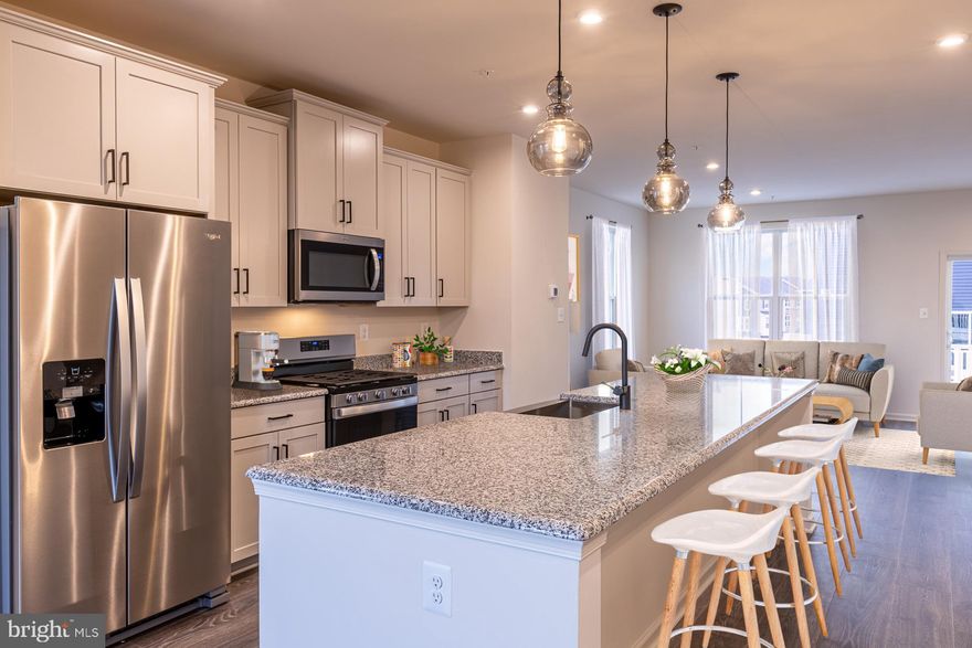 The Cambridge floorplan offers spacious, flexible living across three levels, with the option to add a
fourth-story loft and deck—perfect for extra space and entertaining. This thoughtfully designed townhome features 3 to 4 bedrooms, including a bright, open primary suite on the dedicated bedroom
level, conveniently located near the laundry area. Two sizeable secondary bedrooms and a full bath provide plenty of room for family or guests. On the main living level, enjoy an open-concept layout where the kitchen flows seamlessly into the great room and dining area—ideal for everyday comfort and stylish gatherings. The attached rear 2-car garage leads to a versatile recreation room or optional fourth bedroom with a full bathroom, adding even more flexibility to suit your lifestyle. As a homeowner, enjoy
community amenities, including the dog park, community playground, pickleball and tennis court, and
community gardens. Plus, enjoy access to Sparrows Point Country Club, which includes a marina, boat
ramp, newly renovated clubhouse with restaurant & bar, an 18-hole championship-style course on Bear
Creek, and the 2nd largest pool in Baltimore County. See your brand-new home today. Enjoy energy savings with our ENERGY STAR® certified and Indoor airPLUS-qualified homes. *Photos are of
the Model home. *This listing reflects the base price for a to-be-built home on a lot in the community.
*Pricing, features, and availability subject to change without notice.