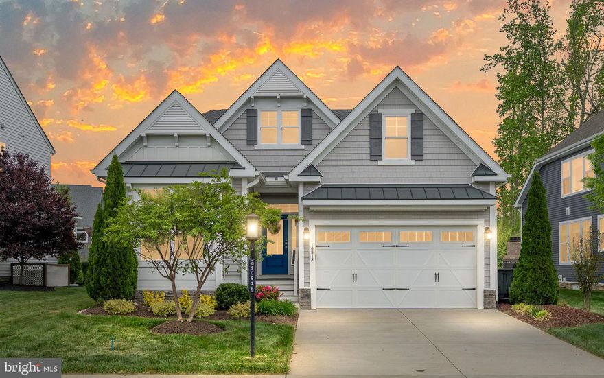 Welcome to River Mill—where luxury living meets thoughtful design. This stunning former model home, featured in the prestigious Parade of Homes, showcases the sought-after Bluebell floorplan by award-winning builder Schell Brothers, one of Central Virginia’s finest. While offering two spacious levels, the home lives like a single-level residence with most of the key living spaces located on the main floor. At the heart of the home is a chef’s dream kitchen—complete with quartz countertops, tile backsplash, custom cabinetry, Viking appliances, Zephyr hood vent, and designer lighting throughout. The adjoining family room wows with vaulted ceilings, custom beam work, and plank detailing, creating a warm, open space perfect for gatherings. The main-level primary suite features dual walk-in closets, a spa-like ensuite bath with an oversized walk-in shower and dual vanities. A second bedroom, full bath, and a dedicated home office with built-in shelves, cabinetry, and French doors add to the home’s functionality. You’ll also love the custom laundry room, complete with storage cabinetry and a built-in pet washing station—a truly unique and thoughtful feature. Upstairs, enjoy a spacious loft, a full bath, and two additional bedrooms, including a second primary suite with private ensuite—ideal for guests or multigenerational living. An unfinished walk-in storage room provides plenty of space for seasonal items and more. Out front, a park-like setting welcomes you home, while the backyard features a two-tiered, custom hardscaped courtyard with irrigated planter boxes and outdoor furniture, making it the perfect retreat for relaxing or entertaining. Additional features include a two-car direct entry garage, conditioned crawl space, and a long list of high-end upgrades exclusive to the model home. Set in the amenity-rich community of River Mill, just minutes from shopping, dining, and Henrico’s Sports & Event Center. Don’t miss your chance to own this one-of-a-kind home!