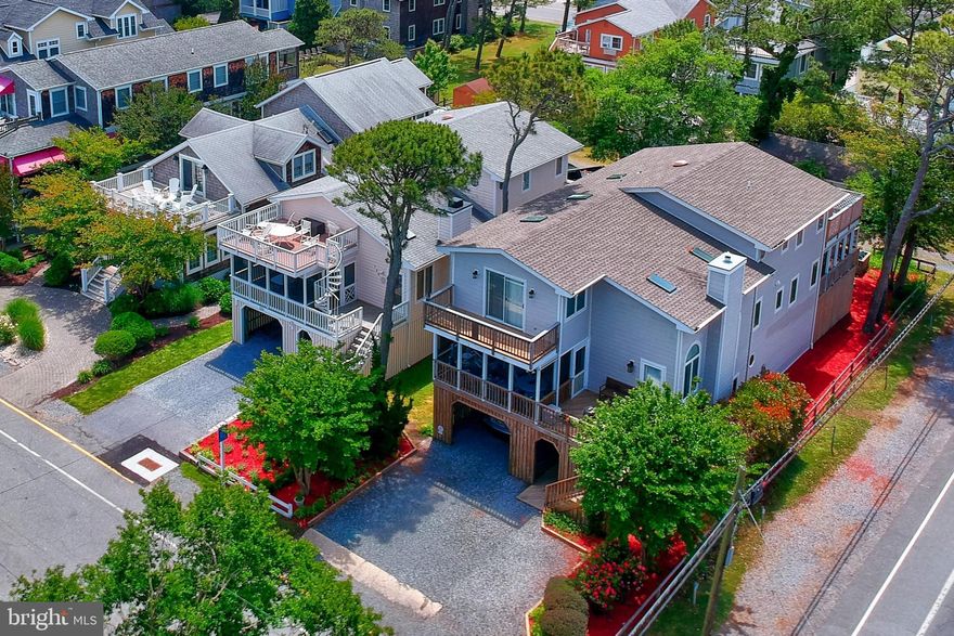 Situated on an ocean block, this fully furnished and well-maintained Wellington Parkway home boasts six bedrooms and four full baths designed to accommodate large/extended families-- or can be the perfect beach rental property. Entering from the lower foyer, take the steps to the main floor where you will be welcomed by the large living area with a vaulted ceiling, the perfect gathering place as it blends the kitchen and large dining area that open up to a lovely screened-in porch for a relaxing morning breakfast. The bedroom quarters on the main floor include three bedrooms and two baths. Two of the three, including a master ensuite, connect to an outdoor screened retreat. Upstairs the expansive primary master ensuite invites you into a light-filled room with beautiful stained glass and skylights that bring in the morning sun. Step out through a versatile bonus room onto a peaceful balcony for a view of the ocean. This floor includes an additional full bath with two bedrooms, both that access a large deck that runs across the back of the home. Each floor-- full of owners' closets galore. The ground level includes 2 outdoor showers, a storage closet for your bikes and beach toys, a utility bath, as well as 'play' spaces for other outdoor activities. On a corner lot that accommodates pull-thru parking and up to 8 cars, Wellington is one of the few streets with an accessible alley. This never-rented home has been loved by generations of the same family since it was built. Start your own beach traditions here and make it your own, or purchase as a great investment property. Located a quick walk to the beach, and south of downtown Bethanys restaurants, shopping, and boardwalk.