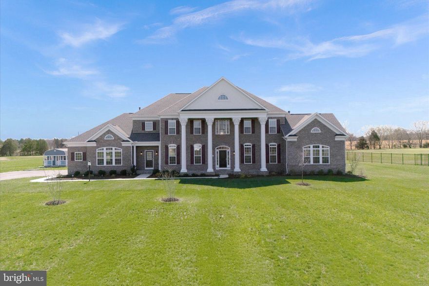 Welcome to Aden Road! This exquisite property, crafted by Augustine Homes, showcases the Stratford III floor plan, offering 5 bedrooms, 6 full bathrooms, and 1 half bath, all thoughtfully designed across over 8,600 square feet of living space on 10 acres of land. Built just two years ago, this stunning property offers ample room to live, work, and entertain—all without the restrictions of an HOA.
As you step inside, you’re greeted by a grand two-story foyer, setting the tone for the spacious, open-concept design that follows. To your right, the inviting sitting room features a double-sided fireplace, seamlessly connecting to a bright, light-filled sunroom. This area includes a full bathroom and a walk-in closet, offering great flexibility to potentially convert it into a main-level bedroom.
Across from the foyer, the formal dining room provides the perfect setting for both intimate family dinners and larger gatherings. A butler’s pantry, with its charming pocket door, leads into the jaw-dropping gourmet kitchen, where elegance and style are on full display, featuring top-of-the-line finishes and exquisite design details. The kitchen showcases an oversized island, elegant light gray cabinetry that extends to the ceiling, and soft-close drawers. You’ll notice under-cabinet lighting, as well as inside the upper glass-door cabinets, creating a warm and inviting glow. High-end appliances, including a GE Tall Tub dishwasher, a 30” convection double wall oven, a 36” Café cooktop, and a 22 CF Café refrigerator, elevate the cooking experience. Brushed gold accents and pristine quartz countertops add the perfect finishing touches to the kitchen's elegant design.
The kitchen opens into both a second sunroom and a spacious great room, featuring a gas fireplace with stunning stonework and a coffered ceiling, creating a cozy space to unwind or entertain. The main level also includes a convenient half bath, a private home office, and a mudroom with access to the three-car garage, which is equipped with a 220V outlet for electric vehicle charging. A separate entrance from the mudroom provides additional ease and accessibility.
Upstairs, you’ll find three generously sized secondary bedrooms, each offering ample closet space. One features an ensuite bathroom, while the other two share a “buddy” bath. The owner’s suite serves as a serene retreat with a tray ceiling, a private sitting area, and an expansive walk-in closet. For added convenience, the laundry room is just steps from the primary closet. The luxurious owner’s bathroom includes dual vanities, a freestanding tub, and a large shower with dual showerheads, offering a spa-like experience for ultimate space to rejuvenate.
The basement is the perfect entertaining space, with a large rec room, game room, and wet bar featuring quartz countertops. A media room invites cozy movie nights, while a legal bedroom and a full bathroom provide extra accommodations. Plus, there's a hookup for a second laundry room for added convenience. A den, second full bath, home gym, and plentiful storage complete the lower level.
Outside, the backyard offers a small deck ready for grilling (complete with a gas line). New trees enhance the landscape, and the whole-house generator ensures peace of mind during any harsh weather. Electrical outlets on the front porch make it easy to decorate for any occasion, whether it’s a holiday or a special celebration. 
Conveniently located with easy access to shops, restaurants, and commuter routes, this home maintains a serene and private setting. Ready to greet its new owner, Aden Road perfectly balances contemporary living with timeless appeal.