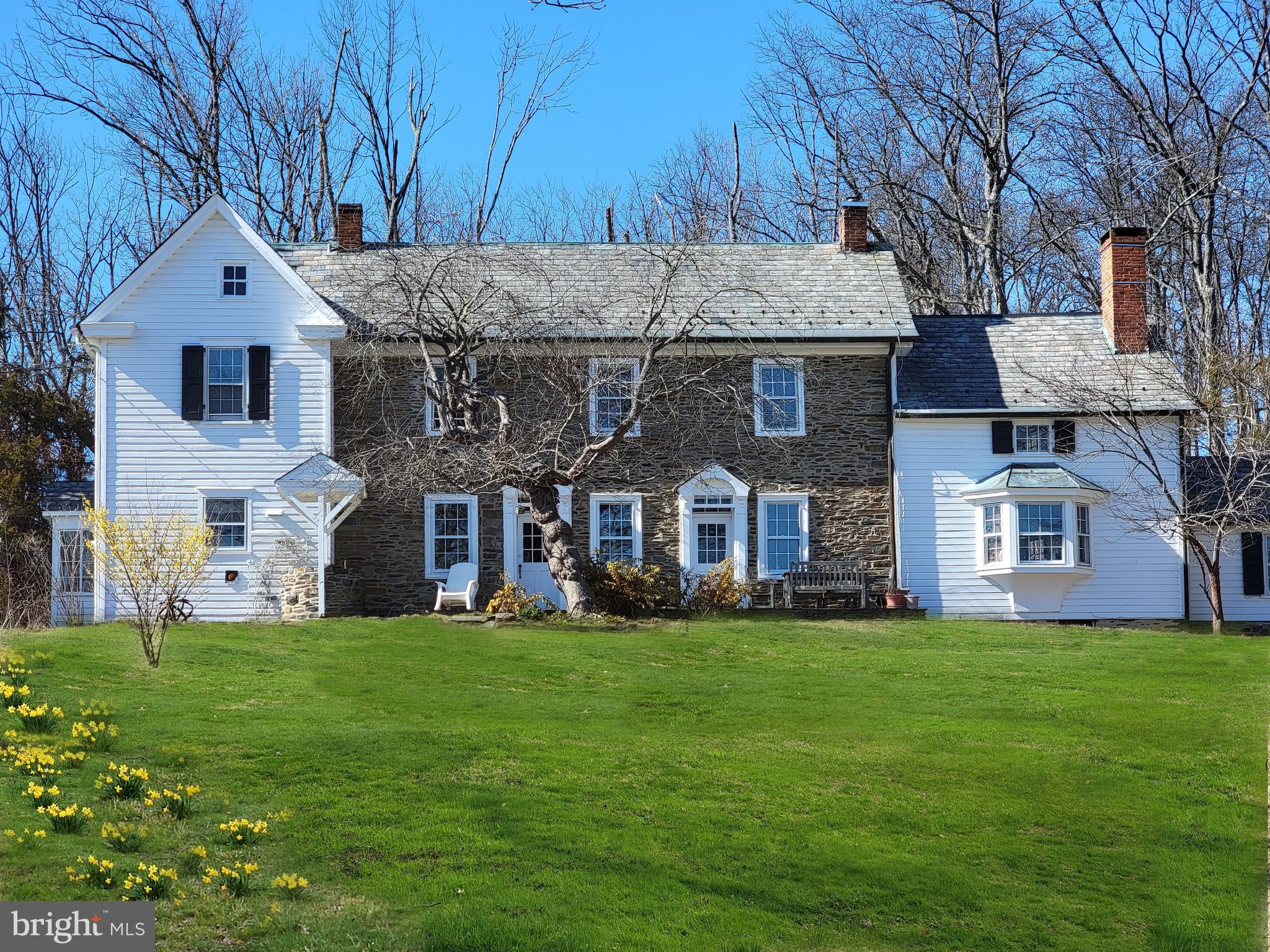 Wellspring Farm offers the romantic setting that attracts every stone farmhouse lover. Set way back from the road with great pastoral views, this property features a bank barn with one stone wall and its own panorama from the second floor. Clapboard additions to both sides of the house give it a sense of balance, and a large rear addition adds generous space to the floor plan on both levels. The family room extends all the way across the back of the house, with generously sized bedrooms upstairs. Interior stone walls with deep window frames add charm to rooms already impressive with vintage features intact. One of the windows in the parlor is built with glass doors, creating a wonderful mini-greenhouse for your plants. Sip your wine from the flagstone patio in the front, overlooking this special property that is guaranteed to fill you with a sense of serenity. This is truly a classic stone house.
