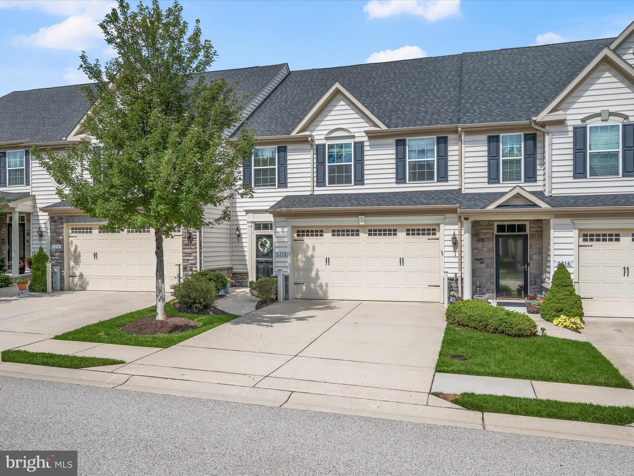 Come to this beautifully appointed three-level home in the highly sought-after Waverly Woods 55+ community of Ellicott City. A two-story foyer with gleaming hardwood floors sets the tone, leading into an expansive open floor plan with soaring vaulted ceilings. The gourmet kitchen is a true centerpiece, featuring two islands, each with a breakfast bar, 42” cabinetry, a decorative tile backsplash, stainless steel appliances, and ample space for entertaining. The dining room is accented with crown molding and chair railing and flows effortlessly into the spacious living room, which features an addition that adds to the living space and access to a large deck overlooking landscaped grounds. A retractable awning provides shade and comfort, perfect for outdoor relaxation. The main-level primary suite offers high ceilings, generous natural light, plush carpeting, a walk-in closet, and a luxurious en-suite bath complete with a double vanity, walk-in shower, private water closet, and additional storage. Upstairs, a loft provides a relaxing retreat, along with two large bedrooms featuring walk-in closets, a shared hall bath, and a vinyl flooring office area, ideal for working from home or easily convertible into a fifth bedroom. The fully finished lower level adds even more versatility with a generous family room, an additional bedroom, a full bath, and abundant storage space. A new HVAC system installed in 2024 adds peace of mind and energy efficiency. Residents of Waverly Woods enjoy access to fantastic community amenities, including a clubhouse, pool, and scenic walking paths. Enjoy easy access to shopping, dining, and recreation with nearby Waverly Woods Golf Course, Merriweather Post Pavilion, The Mall in Columbia, and Weis Markets. This vibrant 55+ community also offers the convenience of low-maintenance living and a welcoming neighborhood feel. Major commuter routes, including I-695, MD-29, MD-32, and I-70, provide seamless travel to both Baltimore and Washington, D.C.