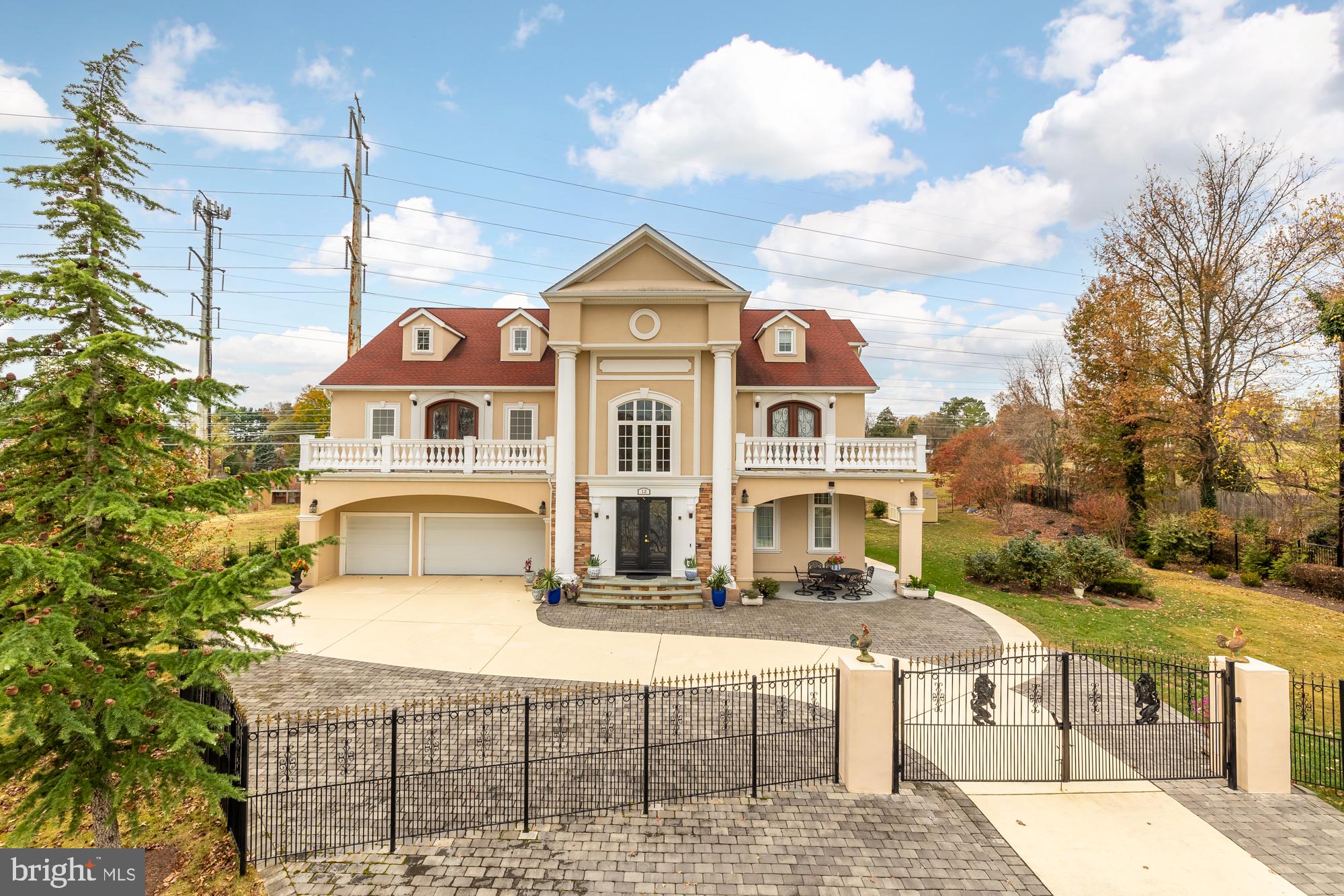 Stunning nearly 8000 square foot residence in Potomac! Nestled in a peaceful cul-de-sac in the gorgeous established community of Regency Estates, this magnificent four level home is the very picture of elegance. Inside the grand entryway you’ll discover an astonishingly high ceiling and refined finishes such as sophisticated chair rail and picture frame molding. Gleaming hardwood floors lead you into the formal living room, which features an exquisite tray ceiling, gas fireplace and built-in cabinets. Opening into the expansive and glamorous dining room, this open concept floorplan is perfect for large gatherings or more intimate dinner parties. The kitchen is a contemporary French country masterpiece, boasting an abundance of cabinets with ornate details, granite countertops, an oversized island breakfast bar, and a classically beautiful tile backsplash. Sleek stainless steel appliances include a double wall oven, wine fridge, and a kettle faucet over the stove. Up the sweeping staircase or personal in-home elevator, the upper level primary bedroom suite is a vast retreat. Featuring a bright and airy private sitting room with its own cozy fireplace and access to an exclusive balcony, this is the regal space you deserve after a long day. The alluring en suite bathroom boasts a double sink vanity, decadent soaking tub, and oversized frameless glass door shower, plus you’ll have a massive walk-in closet with custom closet system. Not to be outdone, the second bedroom also includes an attached bathroom and gorgeous wall of windows. Two additional bedrooms are both sizable, with rich hardwood floors, large closets, and access to the stunning third full bathroom in the hallway. On the upper most level of the residence, you’ll discover a spacious loft and versatile bonus room. The fifth secluded bedroom and sophisticated bathroom could be an ideal quiet space for visitors or in-laws. Downstairs, the lower level offers an expansive light-filled recreation room with a wet bar for entertaining. A sixth bedroom, fifth graceful full bathroom, and a peaceful home office provide you with even more versatility and endless options. Outside, the vast brick patio will be an excellent space for relaxing or open-air entertaining, surrounded by the beautiful garden and impressive wrought-iron fence around the property. On the front of the home, you’ll have a three-car garage and wide driveway, with plenty of space for both parking and storage. This distinguished gem is located in the heart of desirable Potomac, just minutes to Harris Teeter, Westfield Montgomery Mall, Downtown Bethesda and Georgetown, Regency Estates Swim Club, Cabin John Regional Park, Glen Echo Park, Congressional Country Club, and The Music Center at Strathmore. Conveniently situated with quick access to I-270, Old Georgetown Road, Rockville Pike, Democracy Boulevard, River Road, and I-495. Schedule a private tour today, and go into the new year in your breathtaking new home.