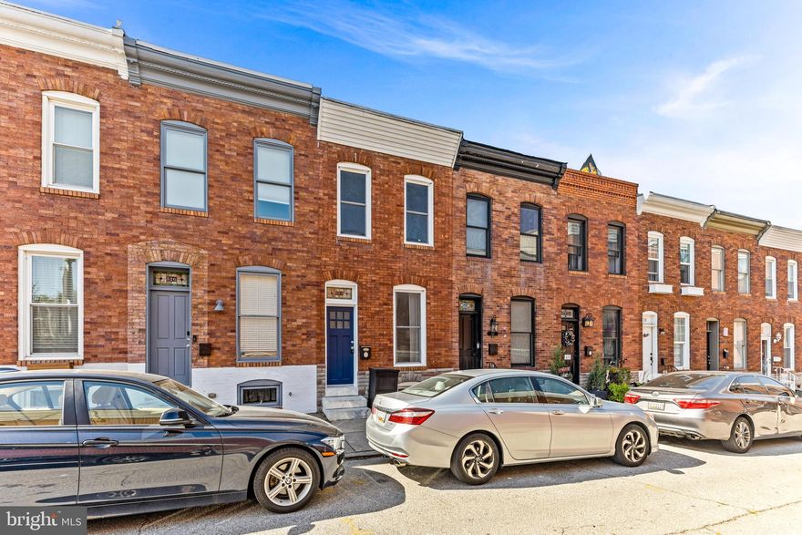 Maryland's Local Brokerage proudly presents 524 S Streeper St! Looking for a home with a PARKING PAD, a finished basement and a stone's throw  to Patterson Park? Look no further than the quiet and sought after Streeper Street. This 3 bedroom, 1.5 bathroom row home is filled with historic charm featuring a double door foyer entry, beautiful reclaimed hardwood floors, exposed brick and an open chefs kitchen boasting tin ceilings and tons of natural light throughout . 42" espresso cabinets, granite countertops, and a huge island work space with a built in beverage fridge make this kitchen ideal for inviting friends over and watching some Sunday Football.  The cozy lower level was recently refinished to include your third bedroom or man cave, plus your half bath and laundry area. Upstairs you will find two spacious bedrooms and an updated full bathroom with skylight. Aside from the proximity to the park, you are within walking distance to all that Canton has to offer including local dining, retail shopping and highway access.
