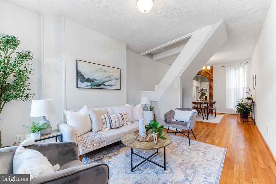 Prime location in the heart of {Federal Hill}- super easy walk to all the perks of living in the city - walk to restaurants, bars, coffee shops, & sports stadiums! Come fall in love with the brick archways in this home & a wood burning fireplace in the bonus room in the back of the house. I imagine that room being additional living room, office, workout space, plant room, or reading room - the possibilities are endless. The kitchen gives quaint country kitchen vibes w/ 2 windows letting in natural light. Gleaming hardwood floors across all levels. Washer/dryer combo located in the full bathroom upstairs. The basement is accessed via trap door under the steps - unfinished dry storage space w/ all mechanicals. Major recent seller improvements including full roof replacement in 2018, in 2015 the HVAC system replaced, hot water heater replaced, and all windows and the 2 exterior doors replaced.   Freshly painted and professional cleaned right before listing! Monthly rental parking available at West Street Garage just steps from this home. Reference floor plans and 3D walkthrough.