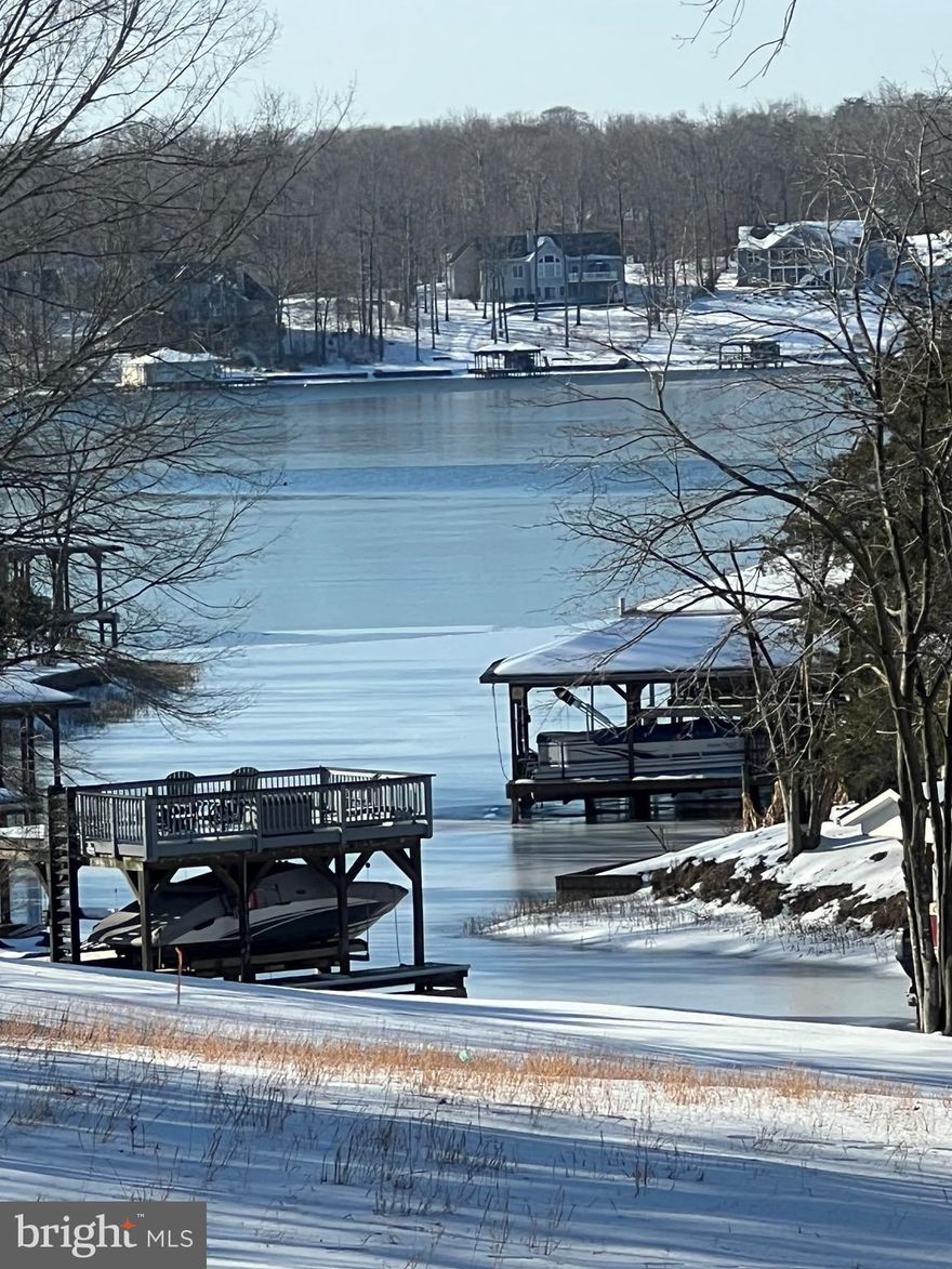 Shared waterfront lot with a slip in the sought-after neighborhood of Rose Valley. Gently sloping and mostly cleared, the lot offers a prime building location. Boat slip # 6 conveys with the property. Located mid-lake, there is easy access by boat to the lake's many restaurants: The Cove, Tims, and the Tap House. It's also a short drive to the off-lake amenities, Food Lion, DG Fresh, Local Wineries, and Breweries. A great opportunity to have waterfront living at an affordable price.